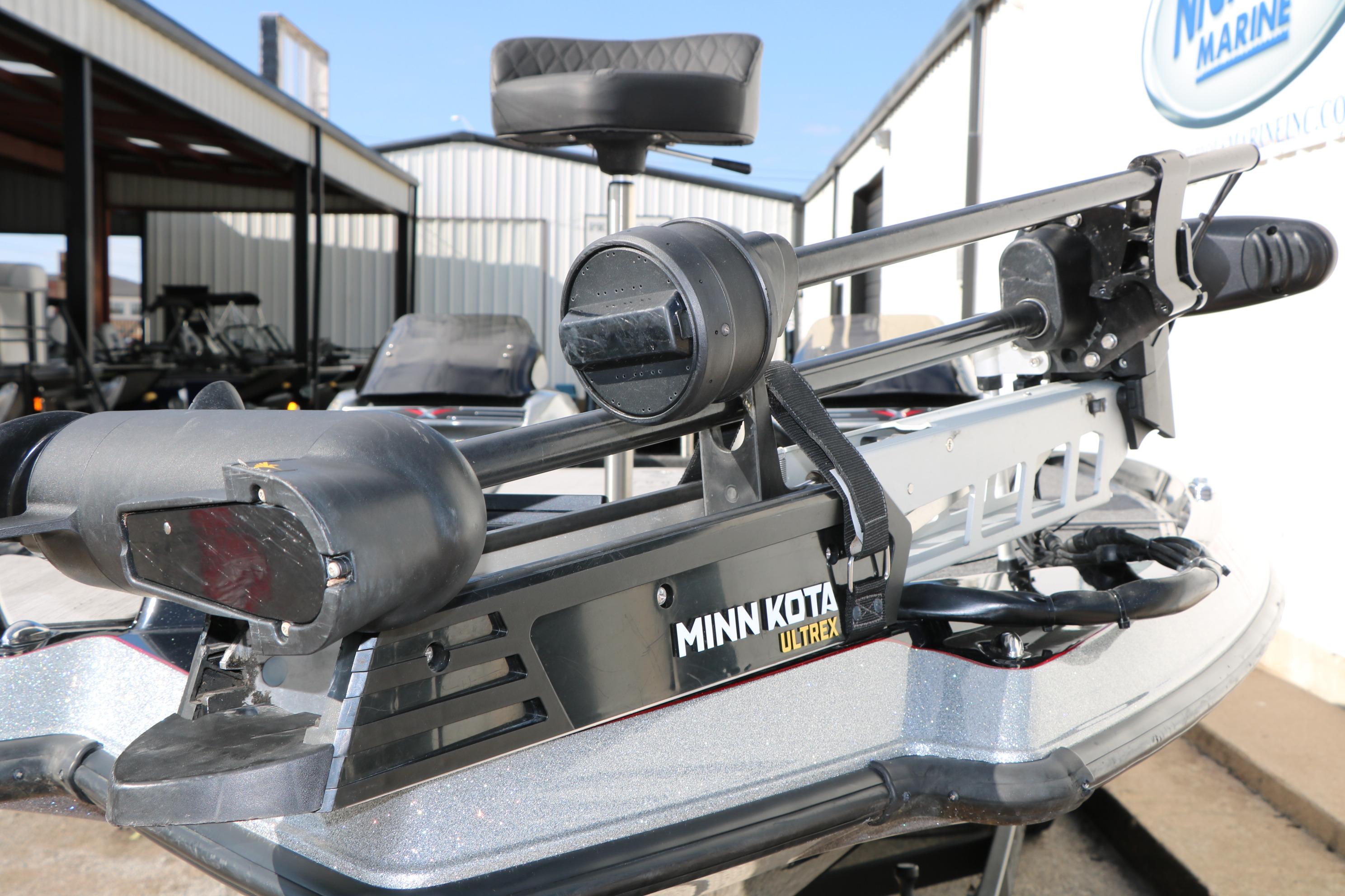 2022 Vexus VX21 boat with Minn Kota Ultrex trolling motor, parked outdoors.