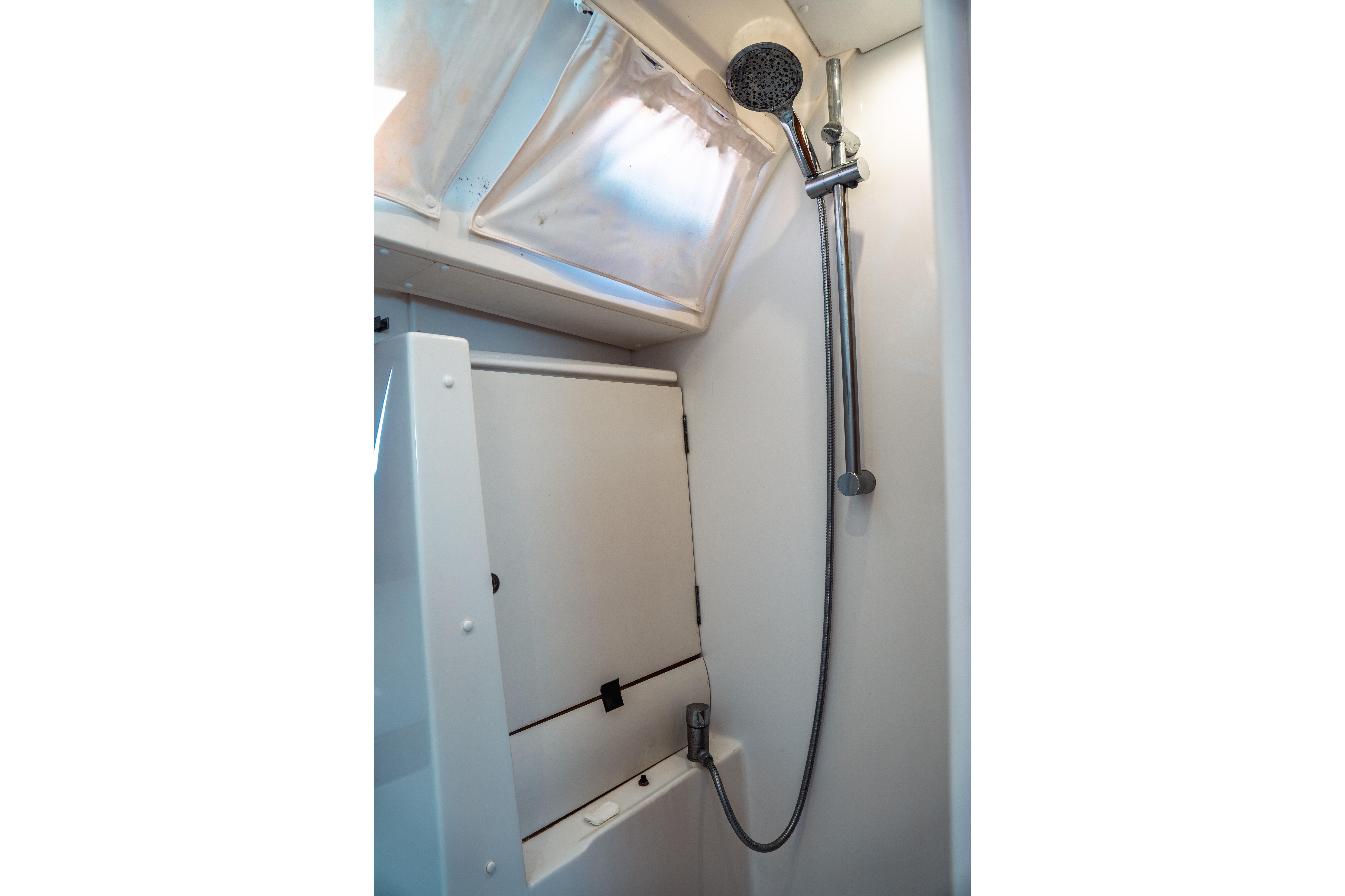 Shower area in 2011 Beneteau Oceanis 50 yacht, featuring modern fixtures and compact design.