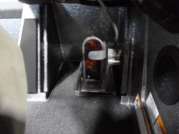 Foot pedal area of 2025 Ranger Z520 boat, featuring textured flooring and control components.