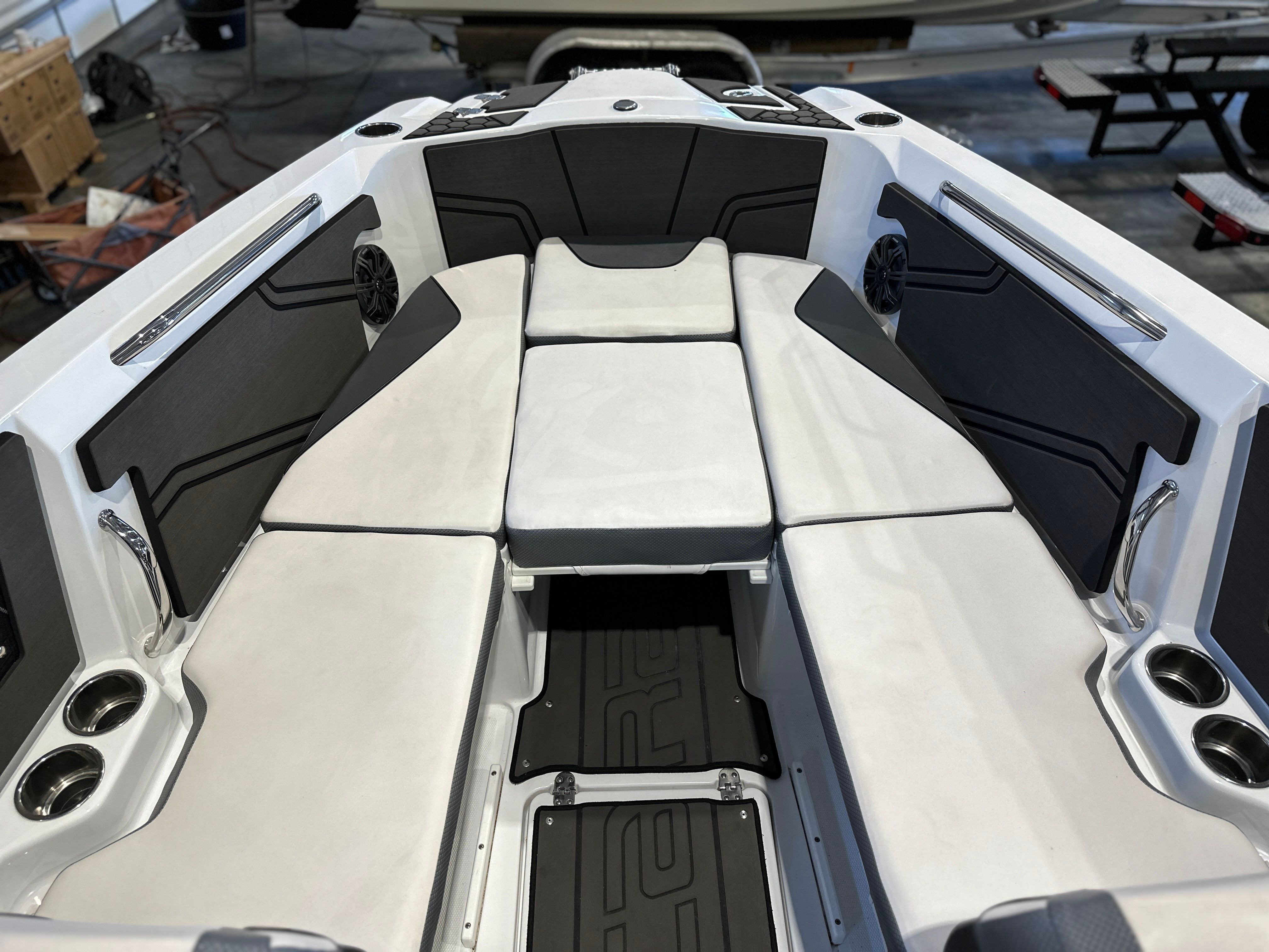 The image shows the interior of a 2021 Scarab 255 Open ID boat with white upholstery.