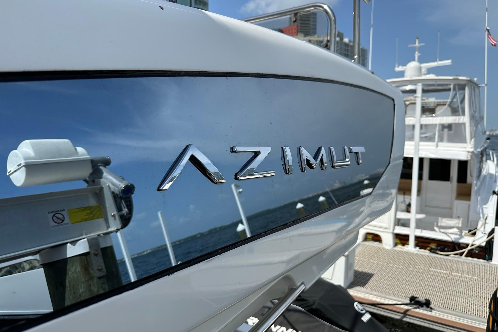 Azimut Fly 53 yacht, 2013 model, docked with cityscape background.