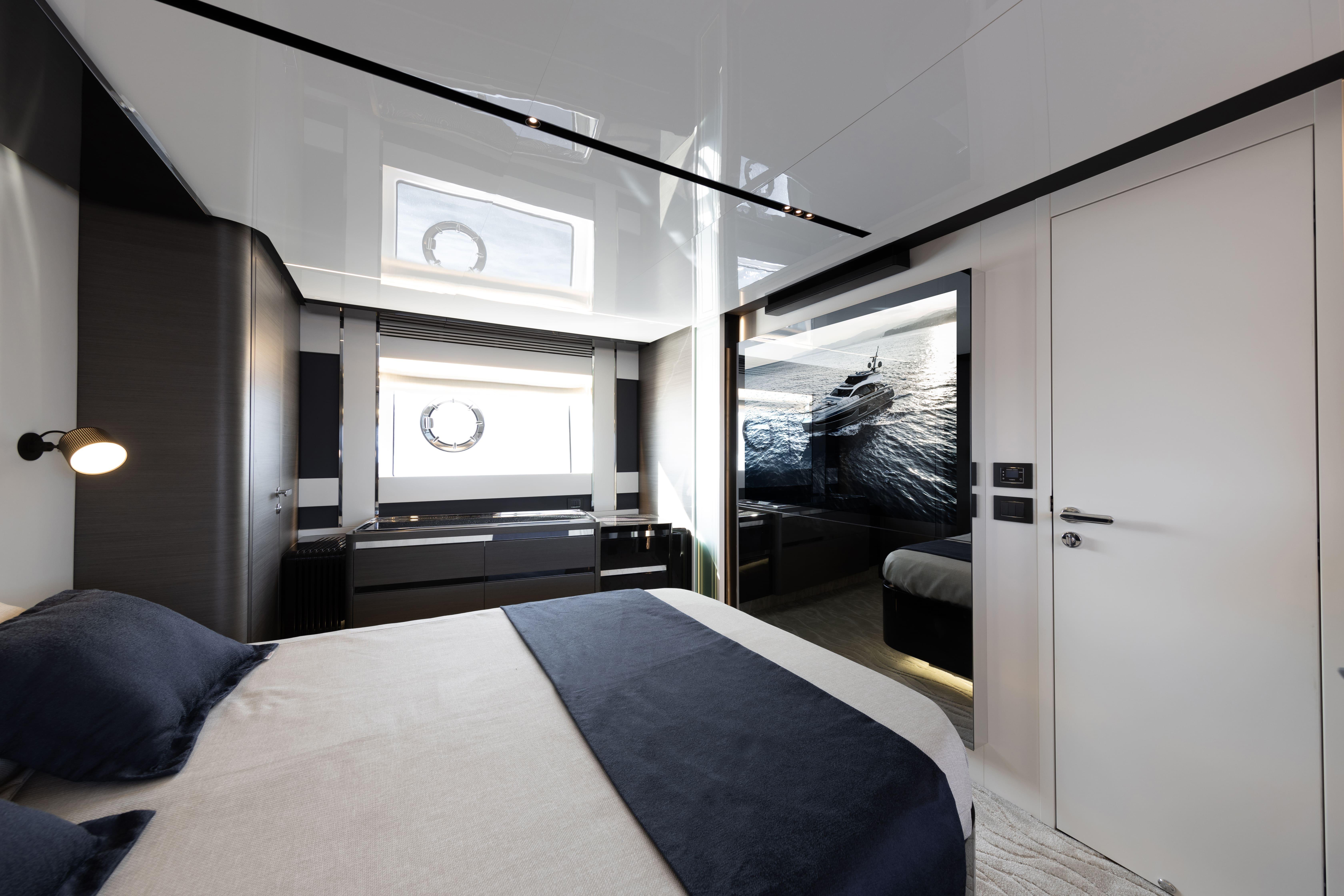 Luxurious bedroom interior of 2021 Azimut S8 yacht with modern design and elegant furnishings.