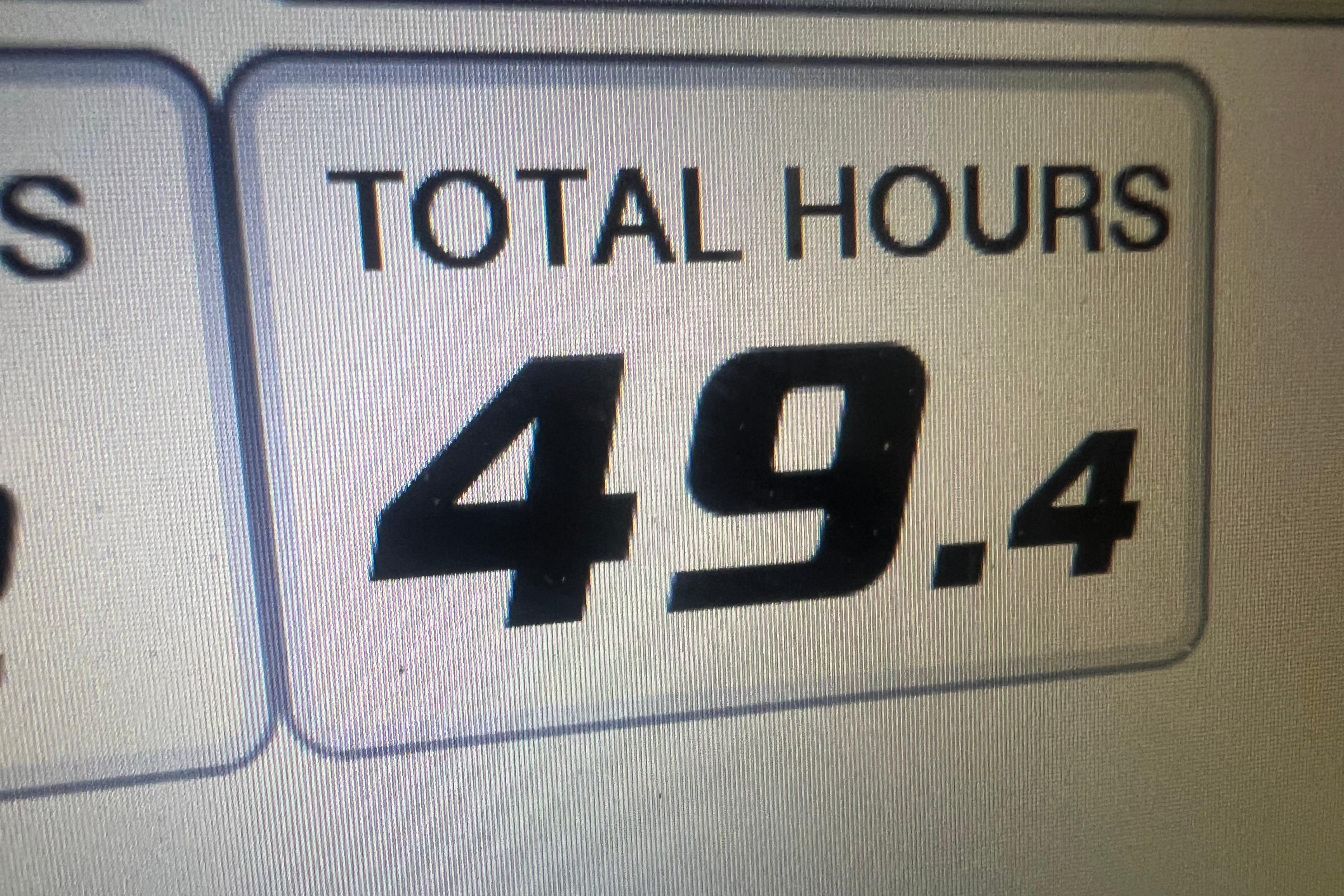Display showing total hours as 49.4 on 2023 Edgewater 230CX Crossover.