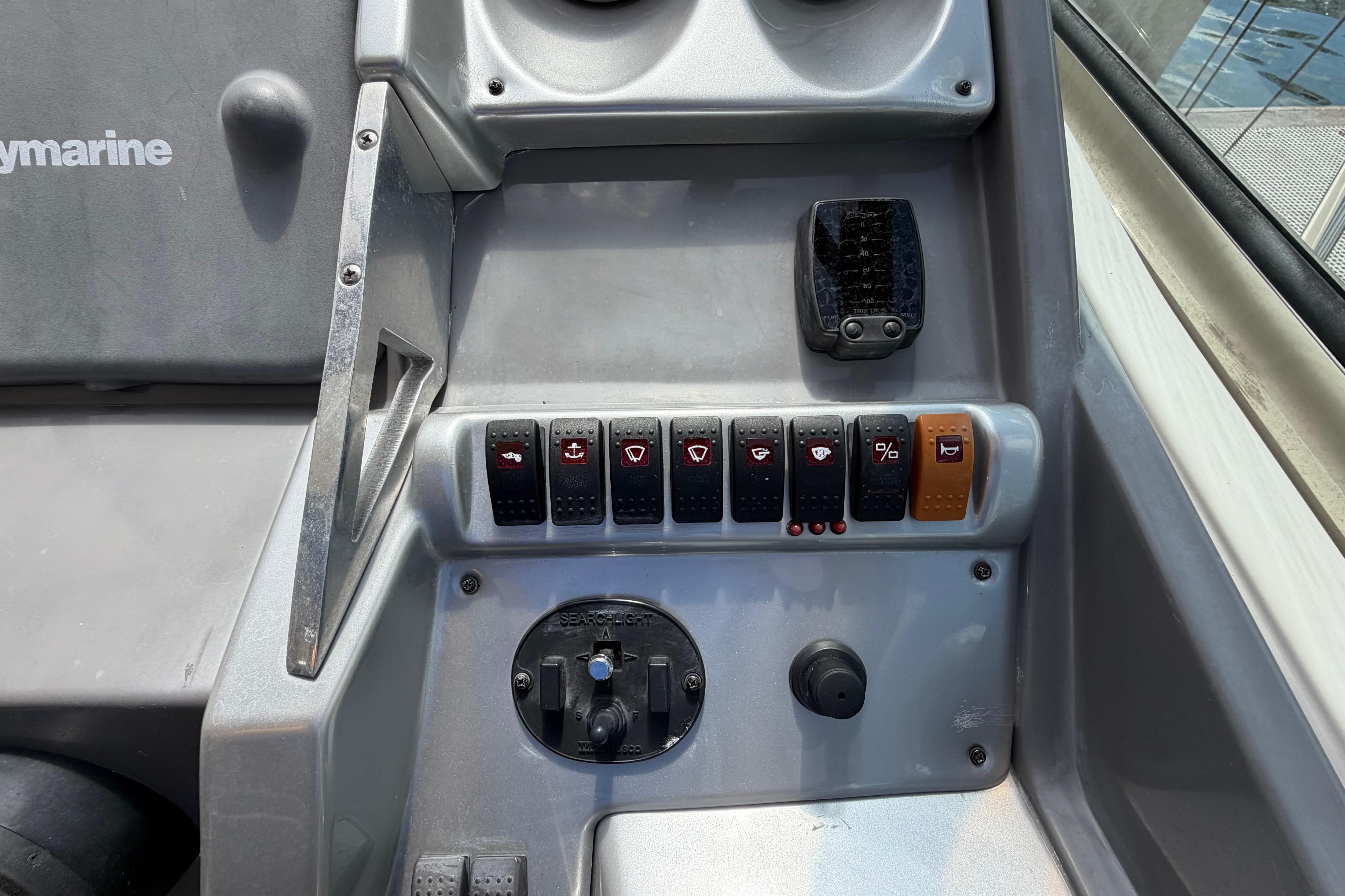 Control panel of a 2007 Monterey 350 Sport Yacht with various switches and dials.