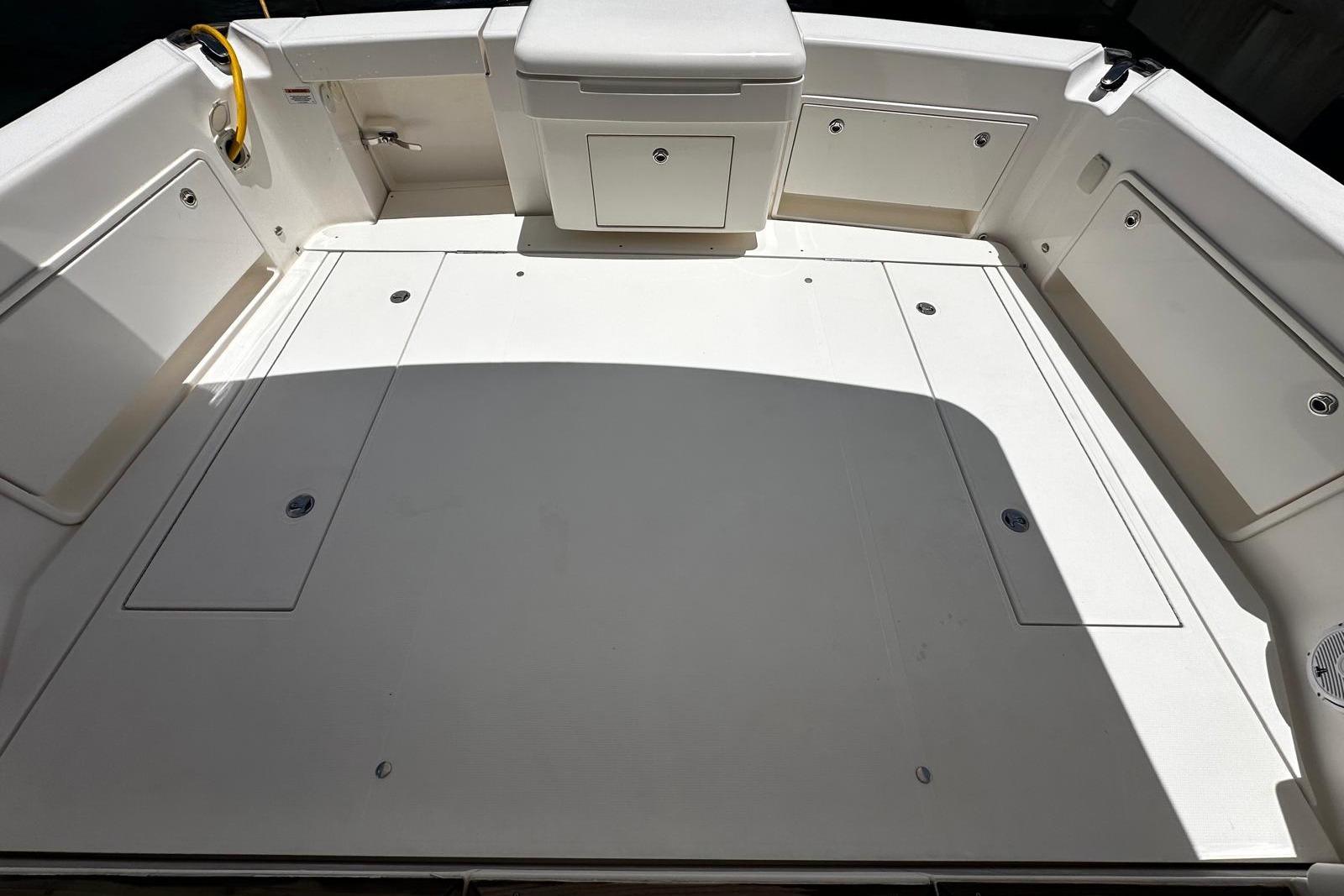 2012 Riviera 43 Flybridge boat deck with storage compartments and seating.