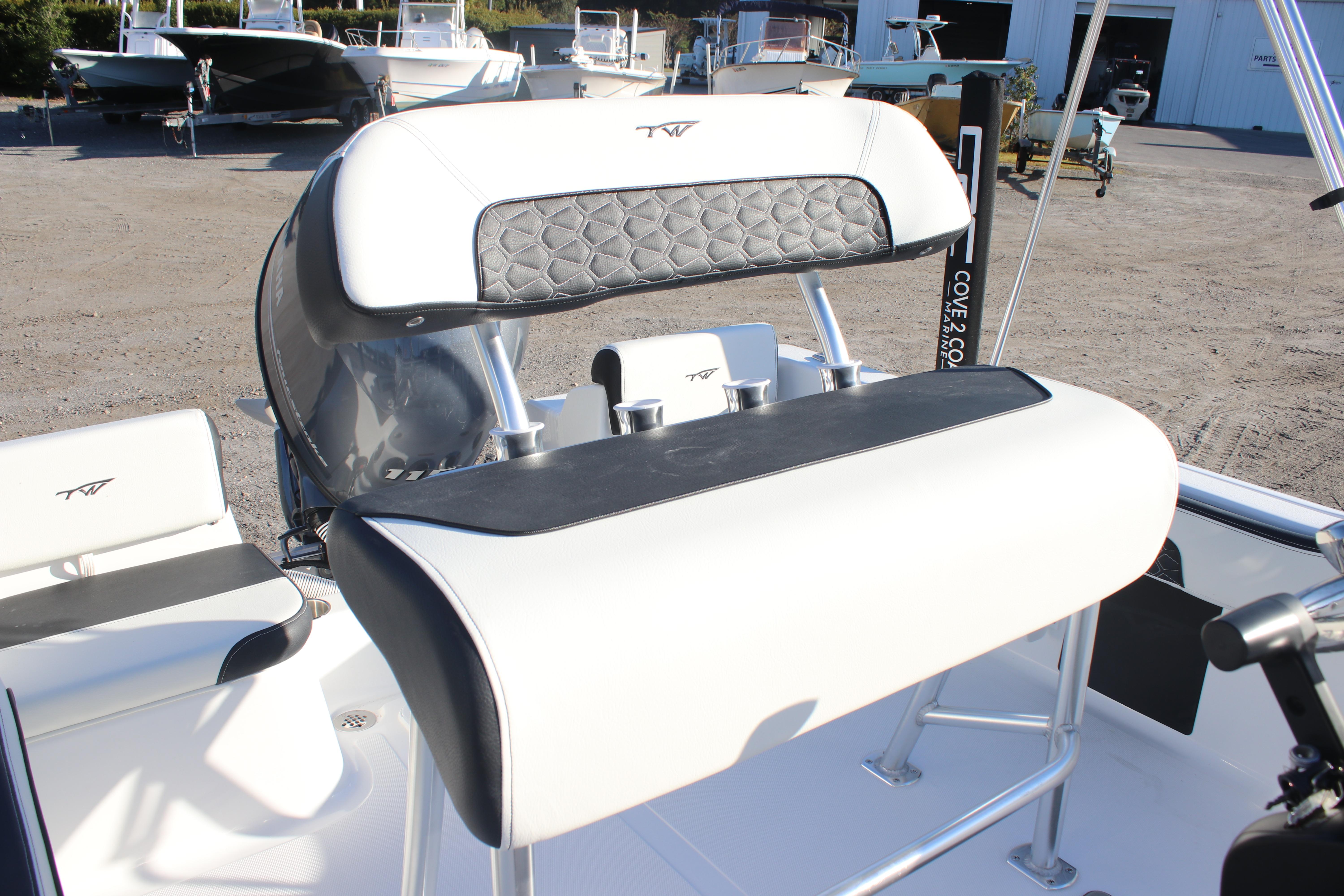2026 Tidewater 180 CC Adventure boat interior with cushioned seating and steering console.
