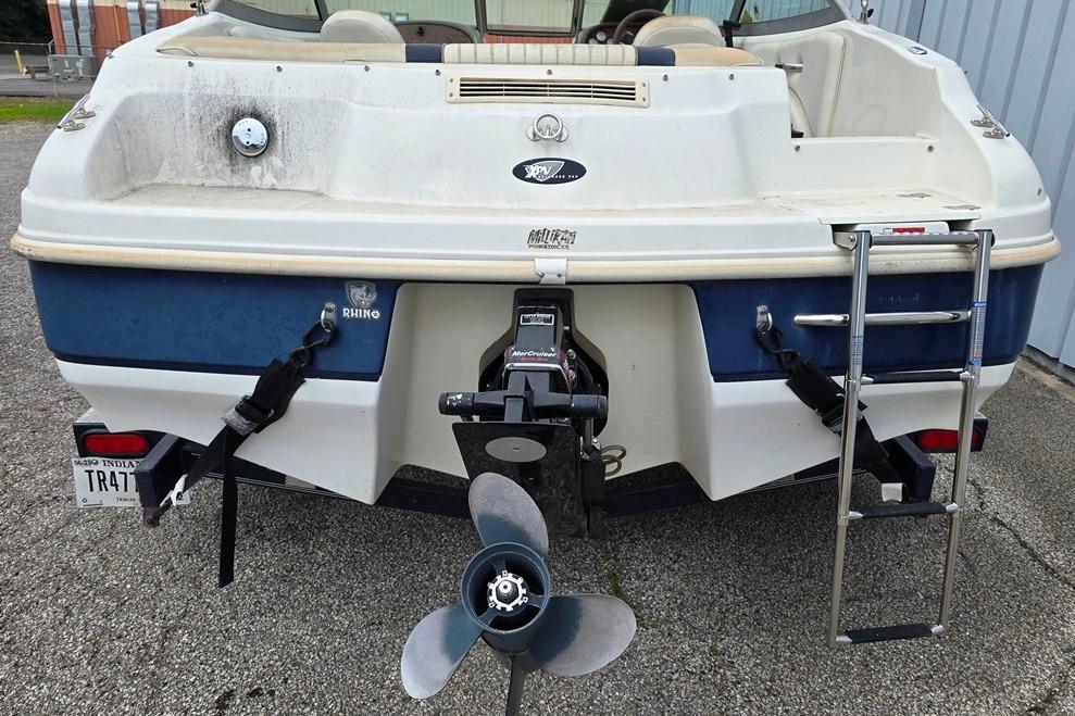 Rear view of a 2003 Caravelle 187 Bow Rider boat with propeller and ladder.