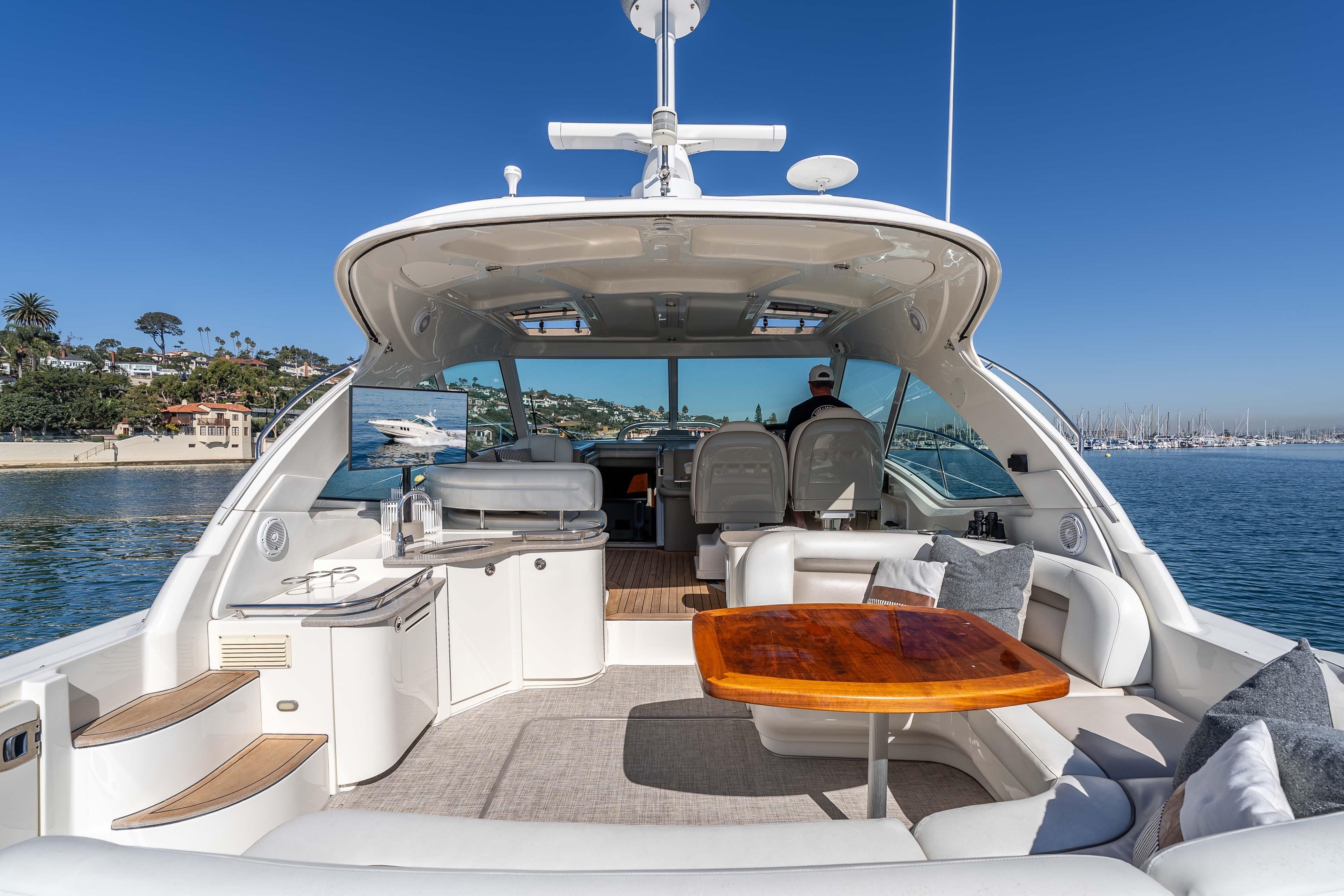2007 Sea Ray 48 Sundancer yacht interior with luxurious seating and scenic ocean view.
