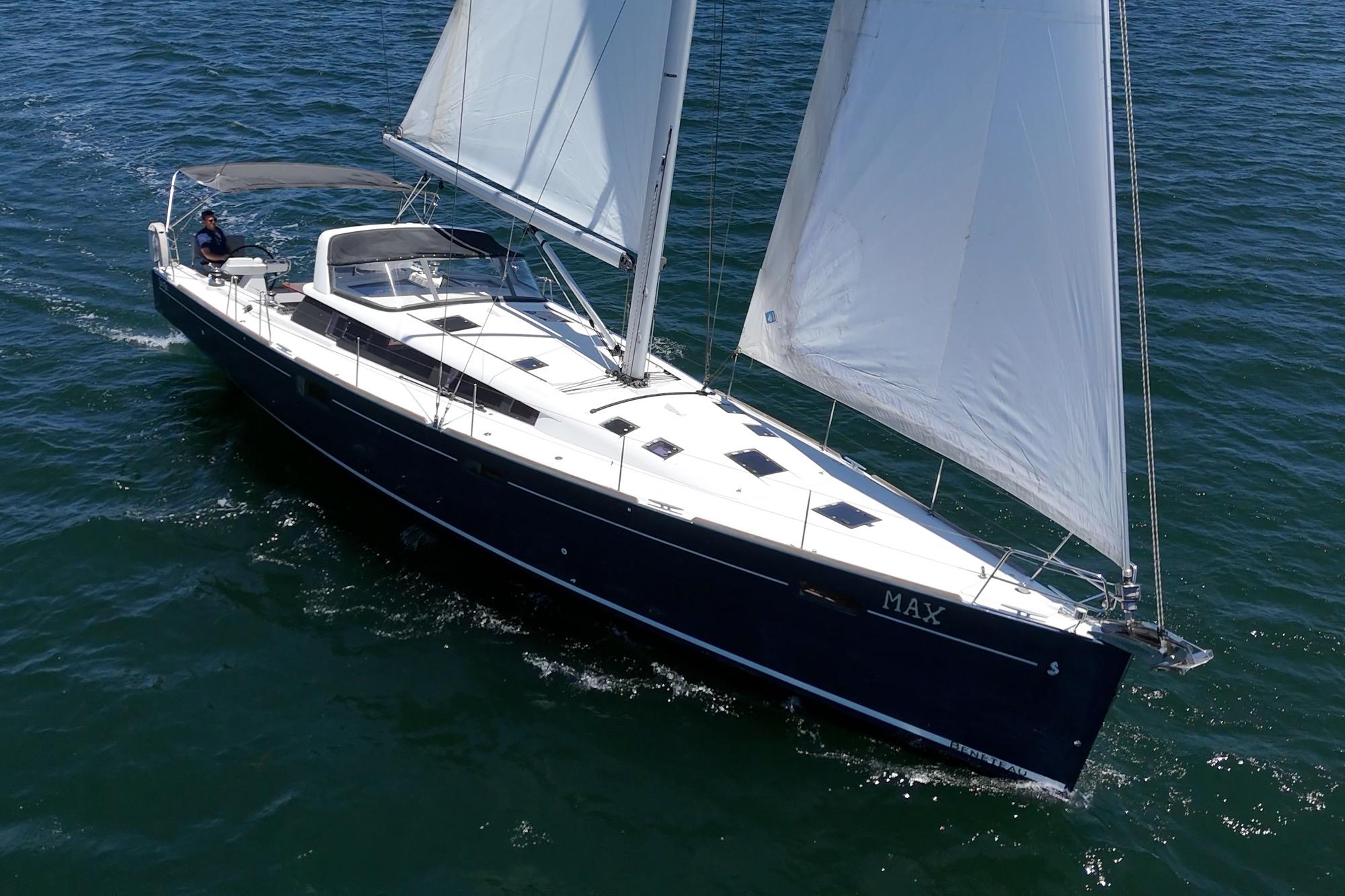 2017 Beneteau Sense 50 sailing on open water, showcasing sleek design and white sails.