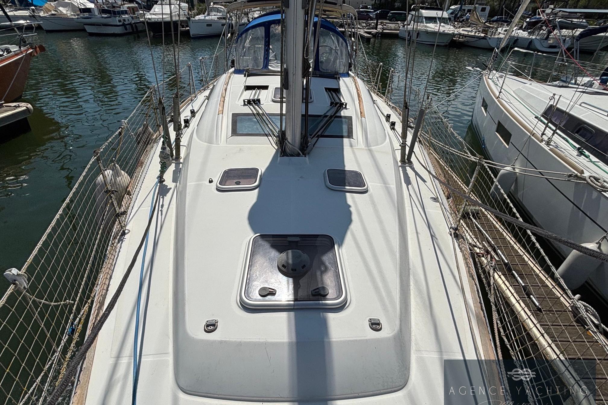 2008 Beneteau Oceanis 40 sailboat docked in marina, showcasing deck and rigging.