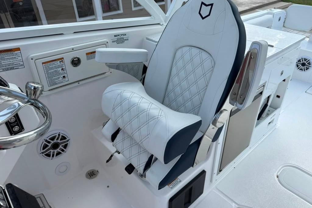 Captain's seat on 2026 Sea Fox 288 Traveler boat, featuring sleek design and modern controls.