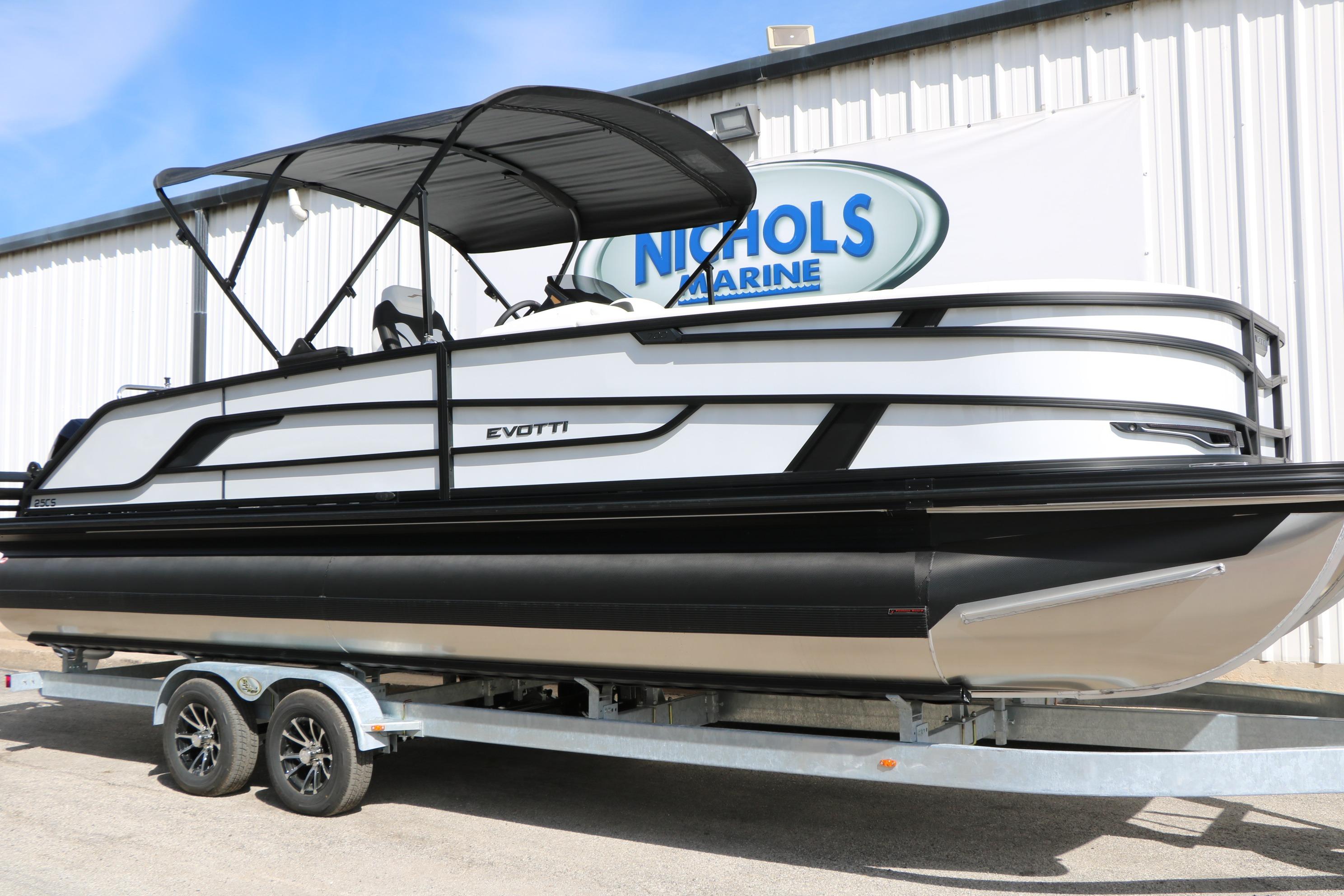 2026 Evotti 725 CS Tri-Toon boat on trailer at Nichols Marine dealership.