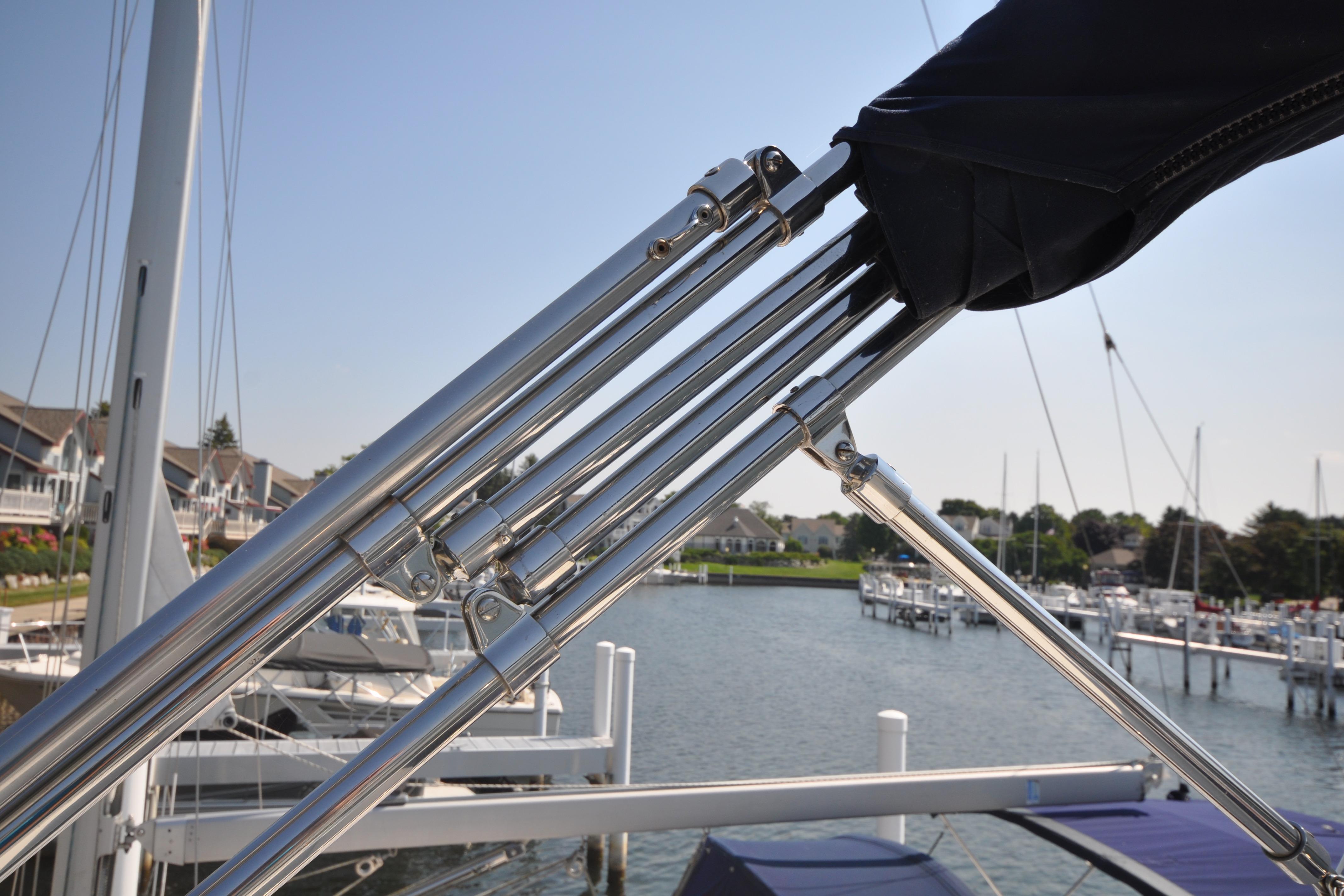 2015 Helmsman Trawlers 31 Sedan with stainless steel fittings at a marina.