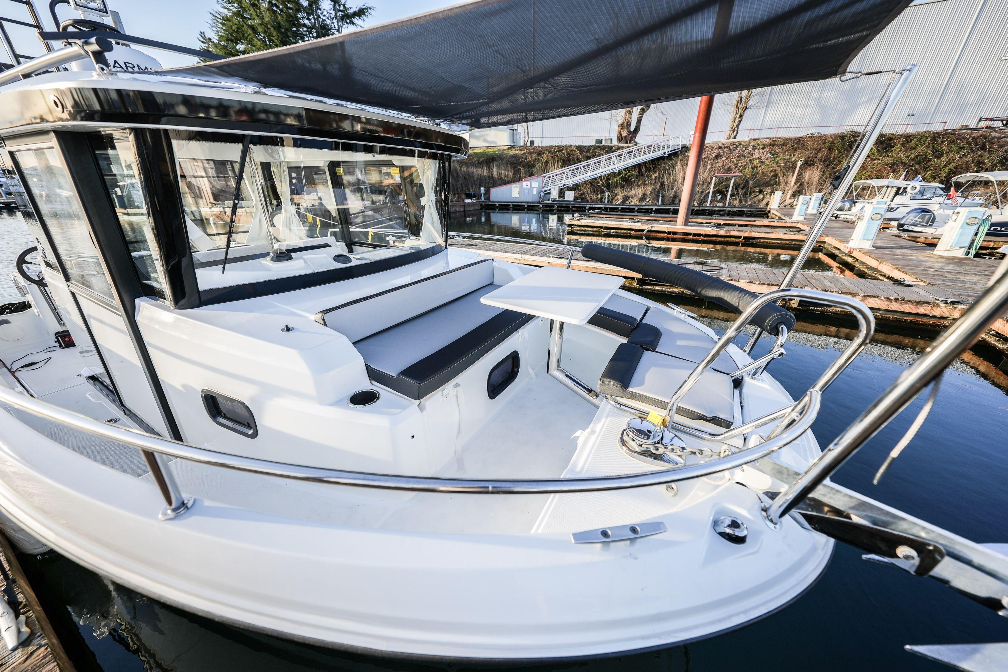 2026 Jeanneau NC 795 Sport boat with sleek design, docked at marina.