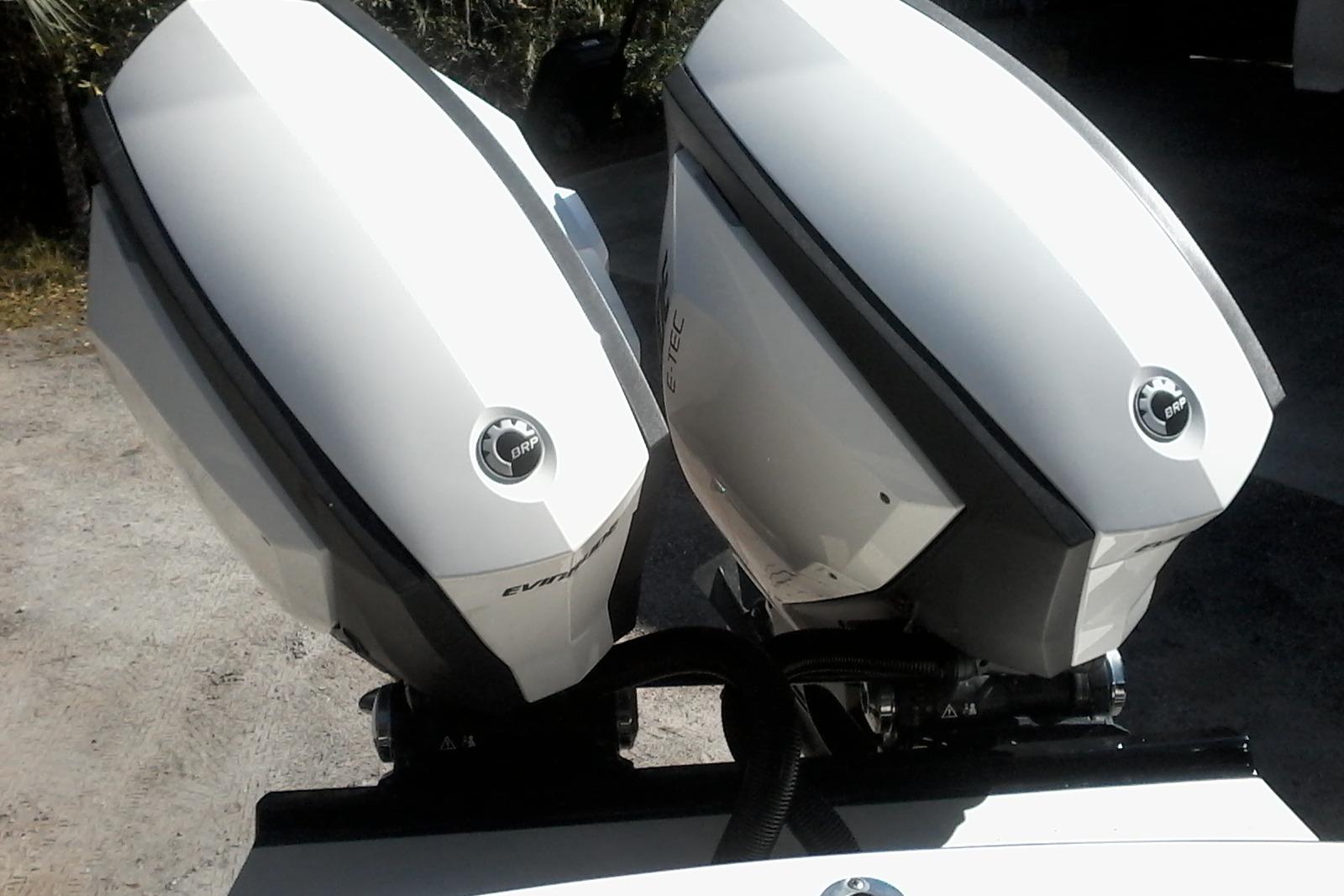Twin Evinrude outboard engines on a 2002 Albemarle 265 Express Fisherman boat.