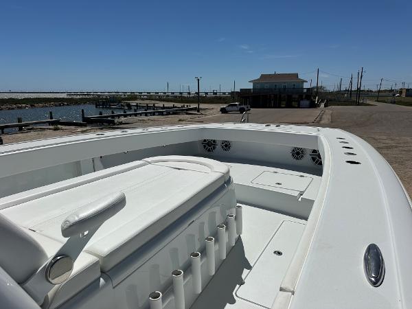 2022 Freeman 42LR boat docked at a marina under clear blue skies.