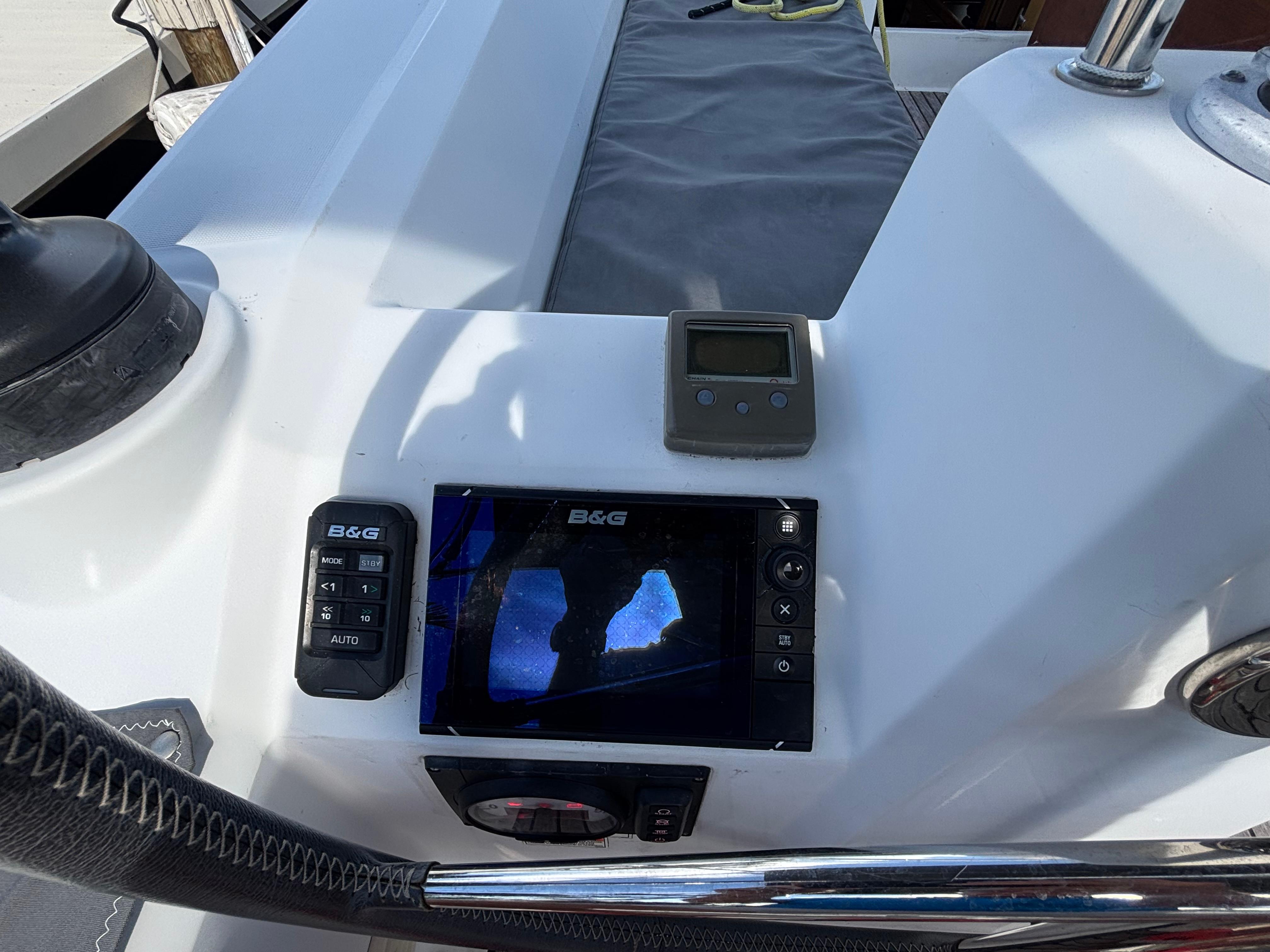 Cockpit of 2015 Beneteau Oceanis 35 with navigation equipment and controls.
