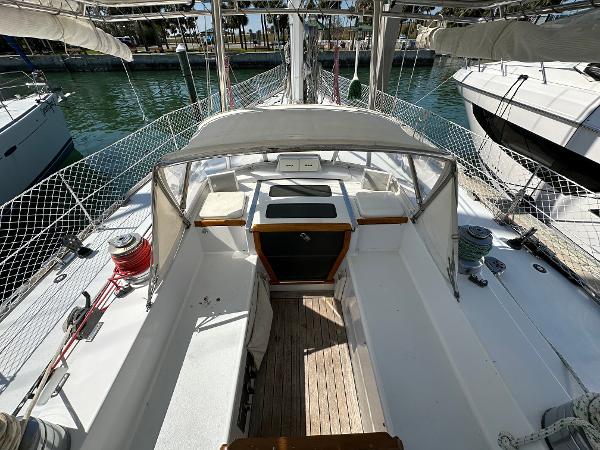 Cockpit view of a 1989 Concordia 52 sailboat docked at a marina.