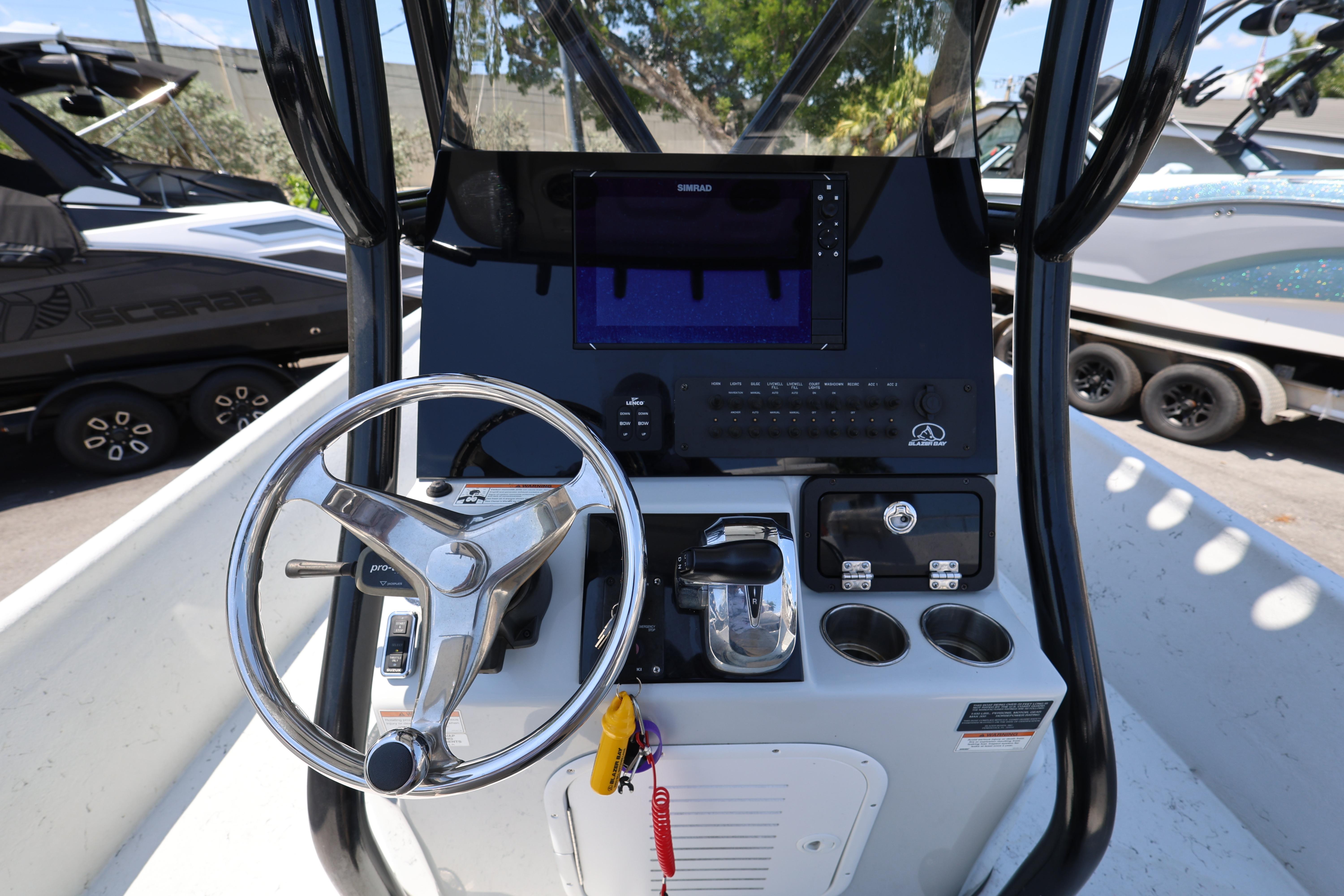 Steering console of 2021 Blazer Bay 2400 boat with modern controls and navigation system.