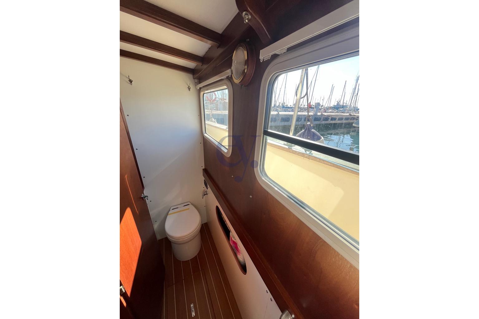 Interior of 2012 Sibma Navale Italiana Armstrong 12 boat, featuring a compact bathroom.