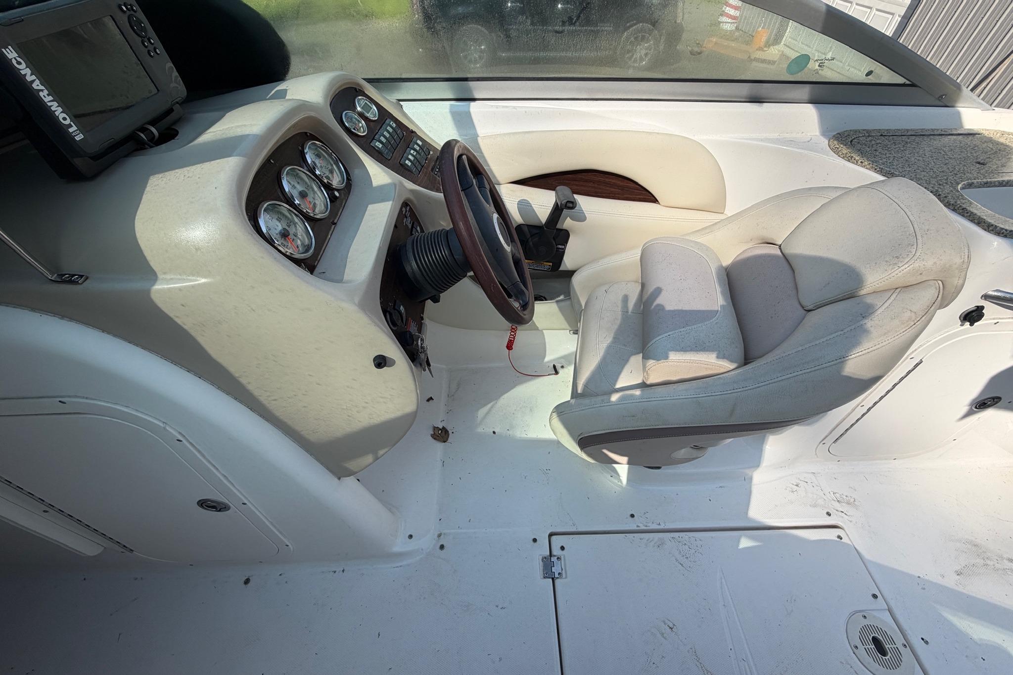 2005 Chaparral 256 SSi boat interior with steering wheel and dashboard controls.