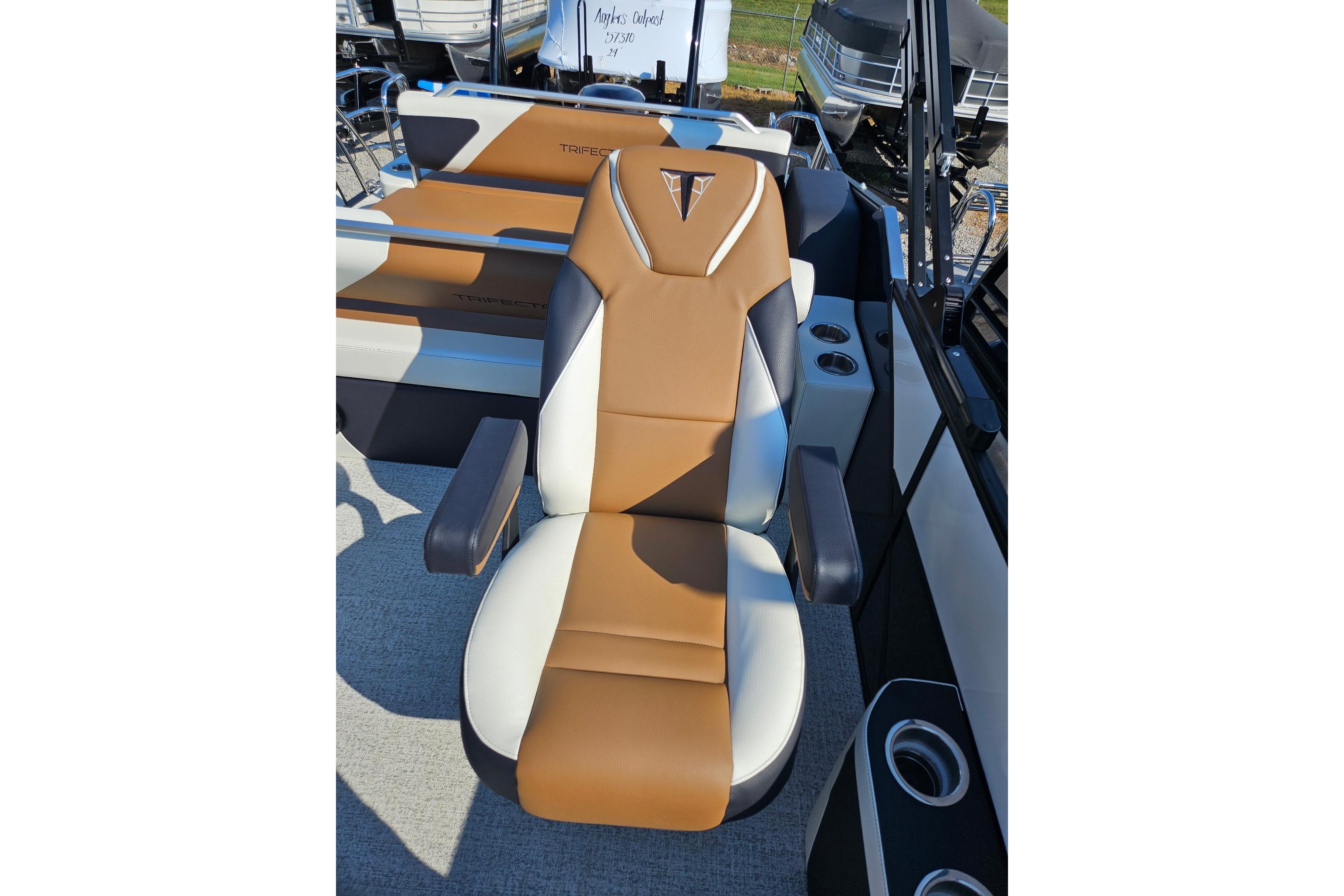 Luxurious seating on 2026 Trifecta 23 ULESS boat, featuring brown and white upholstery.