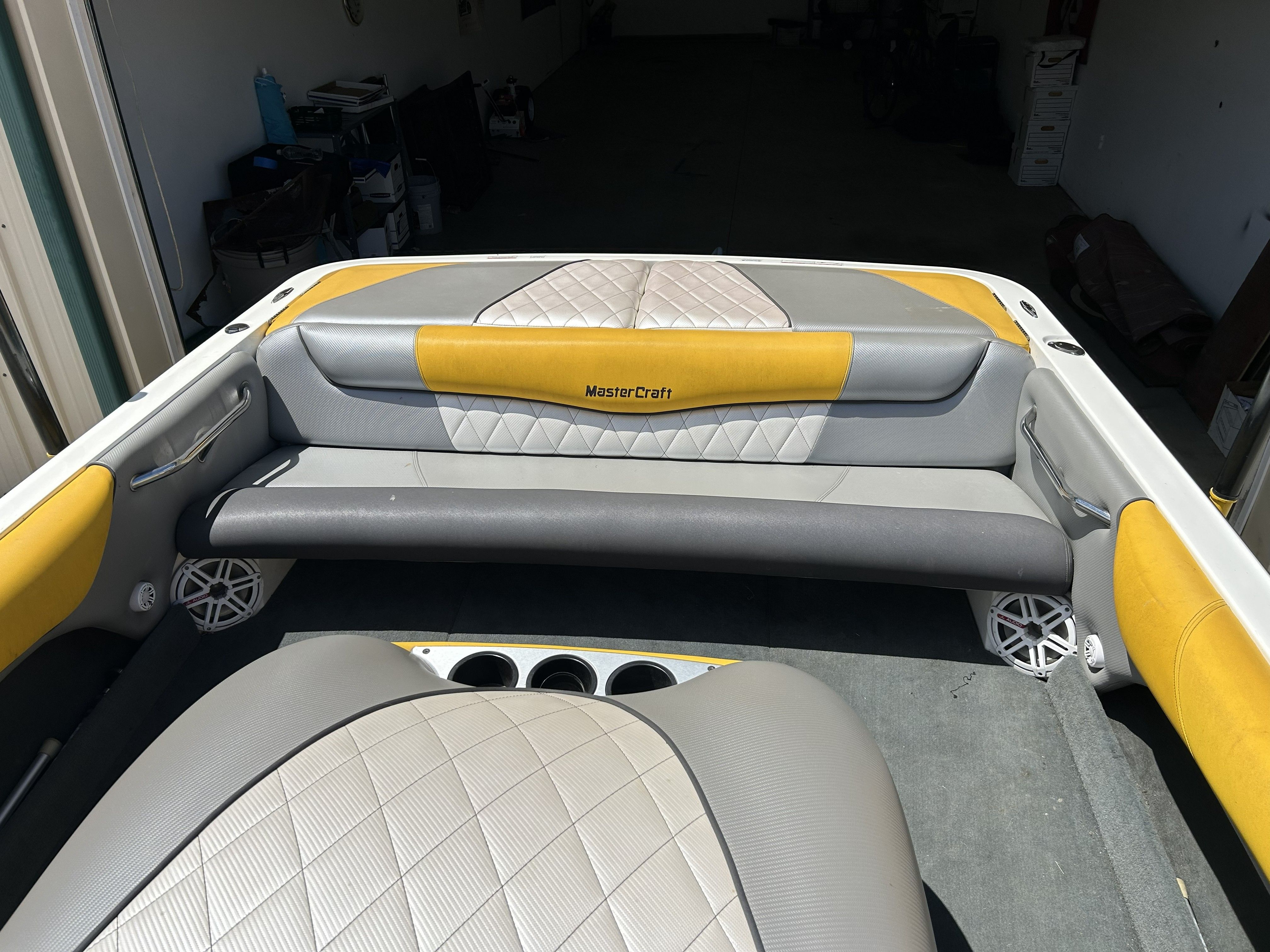 Interior of a 2011 MasterCraft PS197 boat with yellow and gray seating.