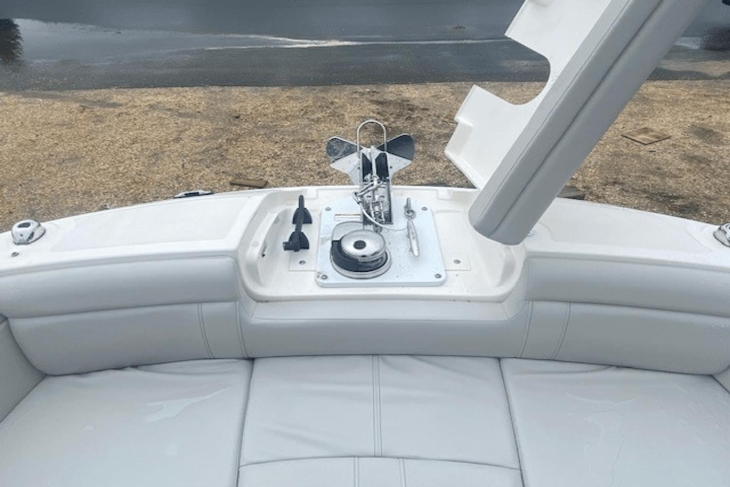 2021 Sea Ray SDX 270 boat anchor compartment with open hatch and seating area.