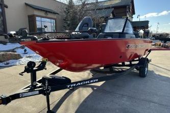 2026 Tracker Pro Guide V-175 Combo boat in red on a trailer, outdoor setting.