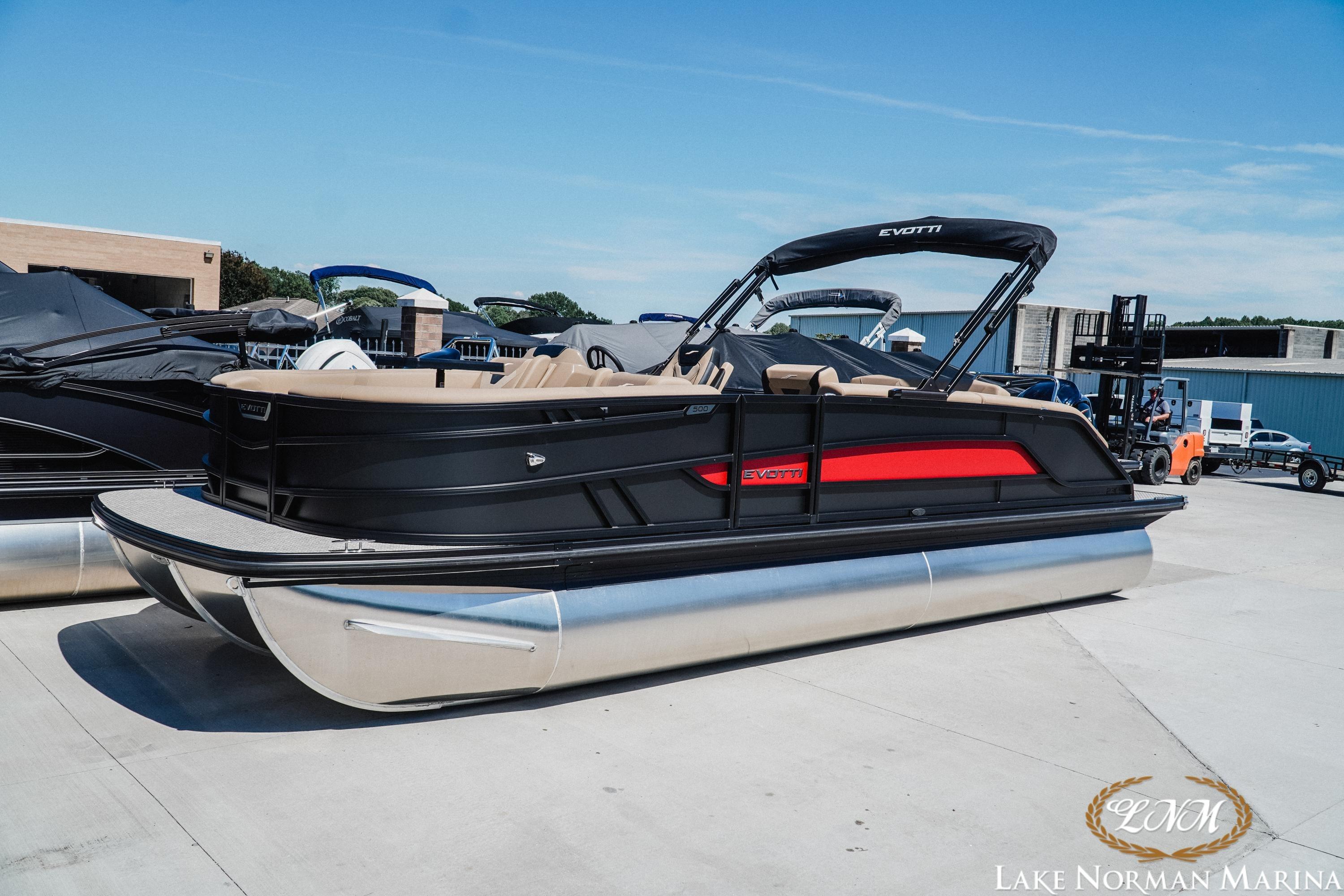 2026 Evotti 523CS pontoon boat at Lake Norman Marina, featuring sleek black and red design.
