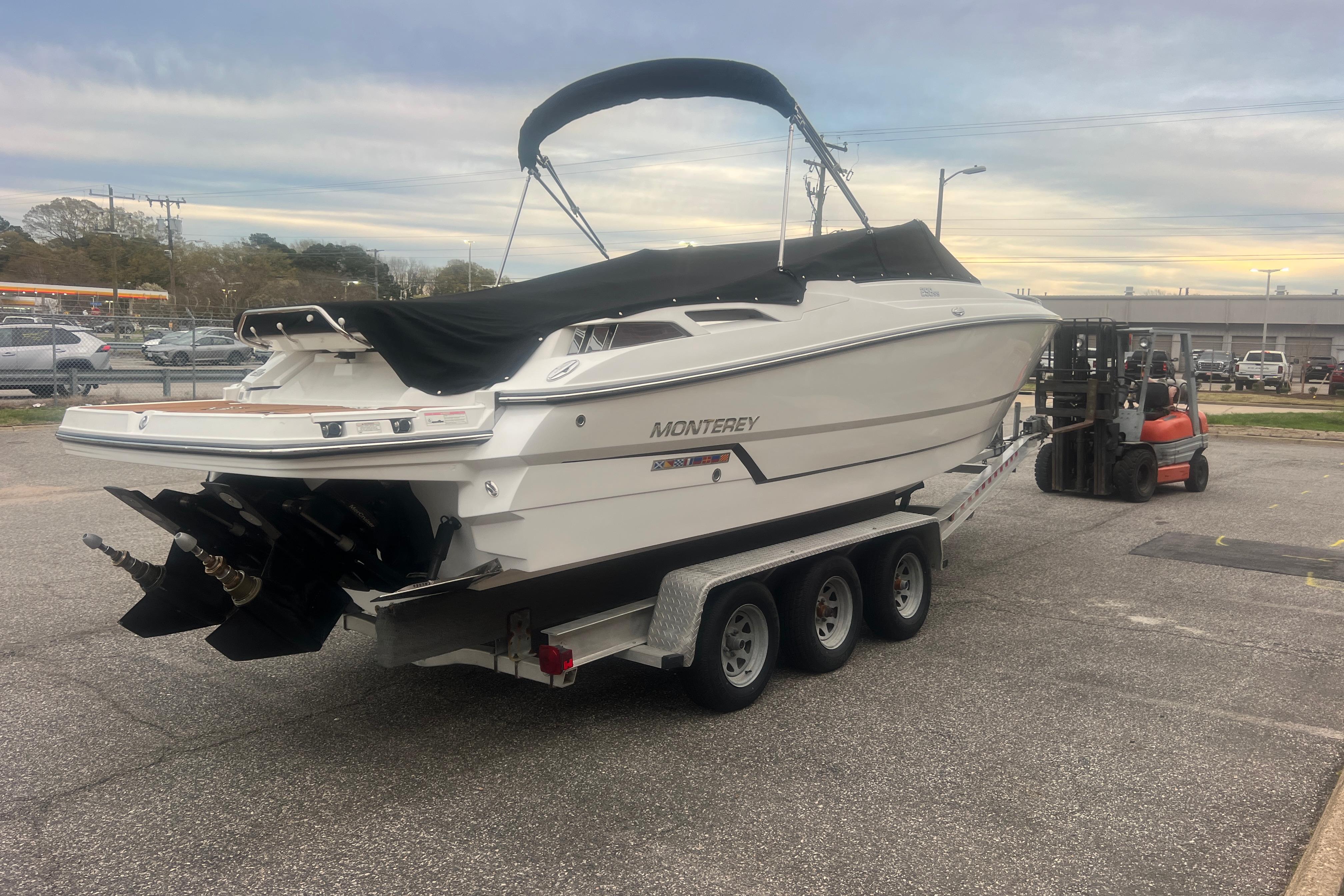 2017 Monterey 298SS Super Sport boat on trailer in parking lot.