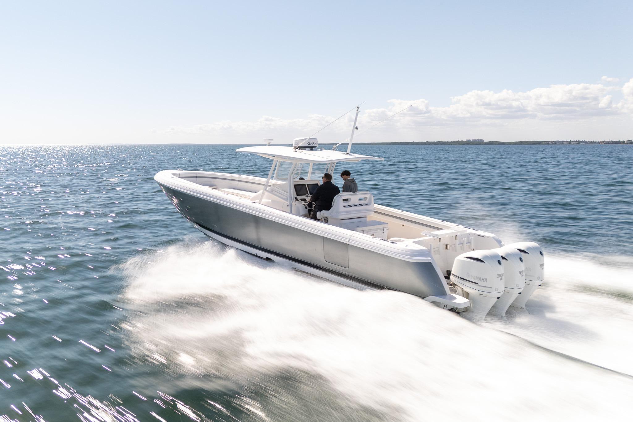 2015 Intrepid 400 Center Console boat cruising on open water, clear sky.