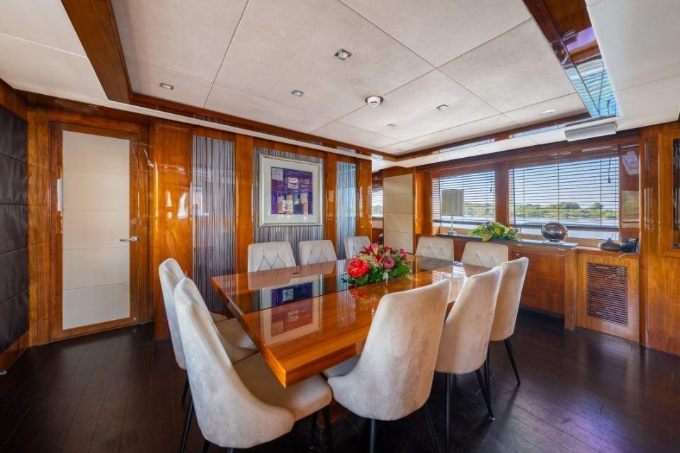 Luxurious dining area on 2009 Sunseeker 34 Metre Yacht with elegant wood finishes.