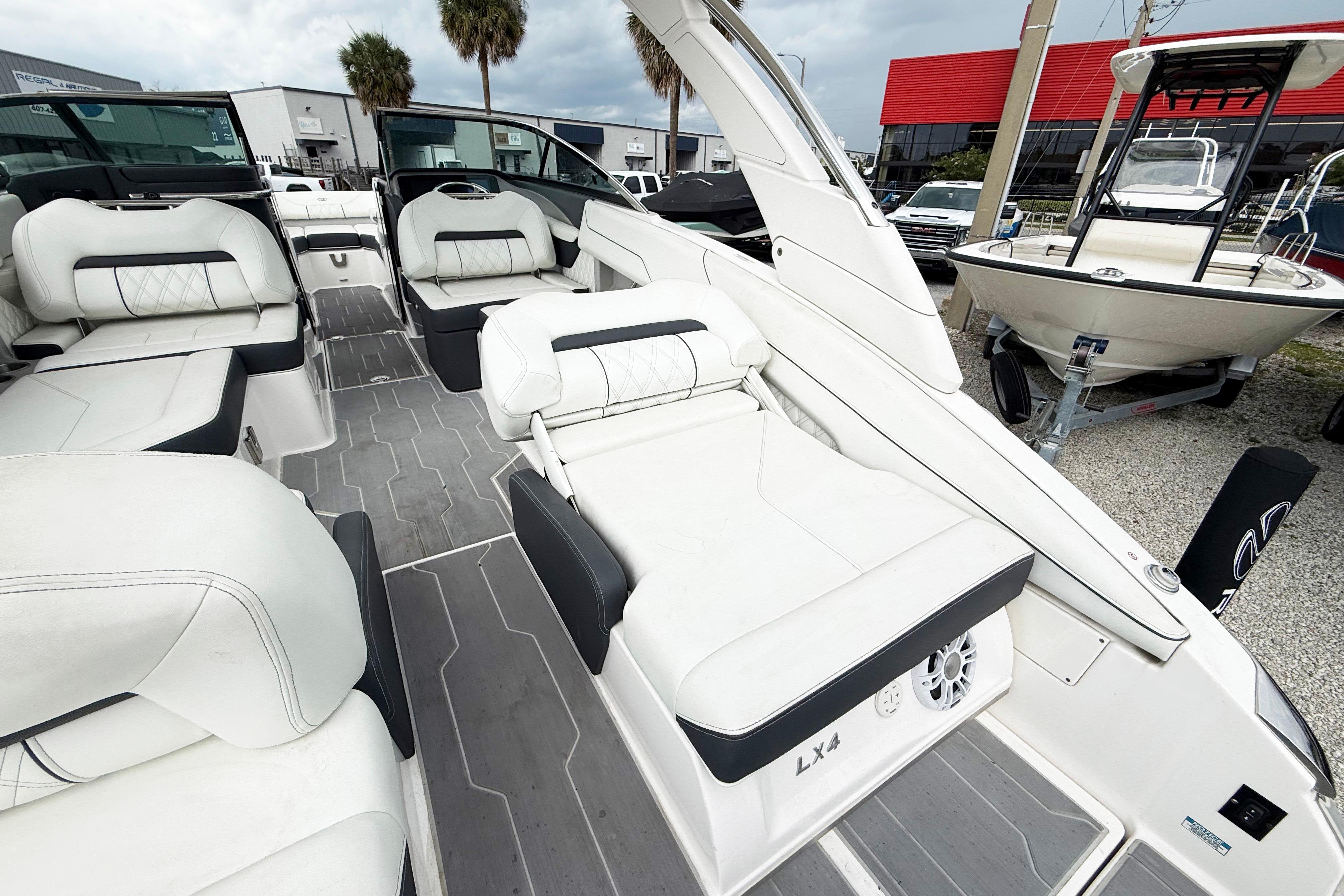 2024 Regal LX4 boat interior with luxurious white seating and modern design.