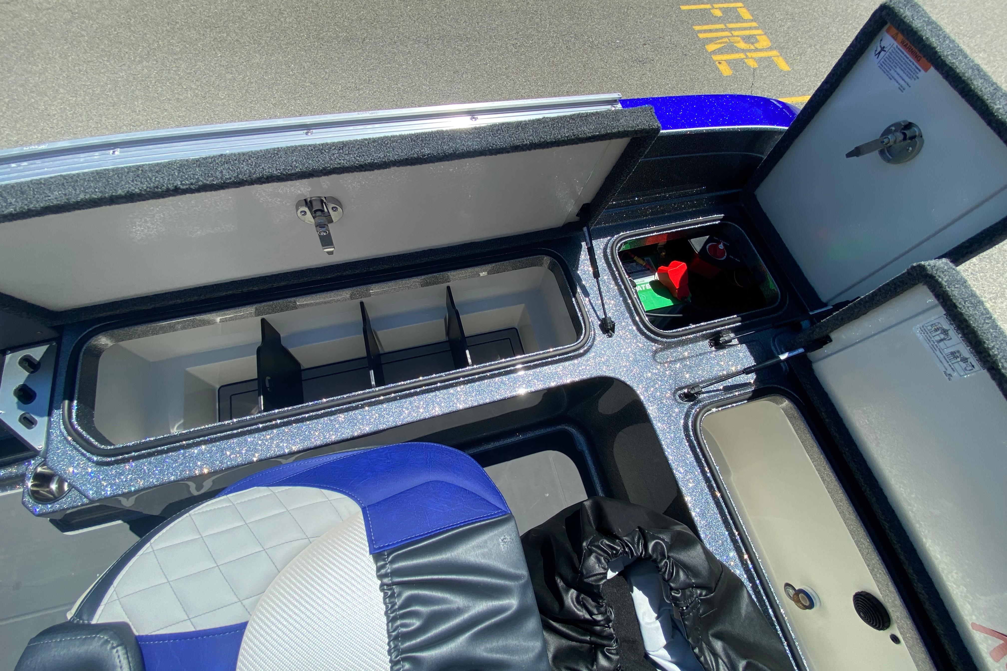 Interior compartments of a 2026 Ranger 622FS Pro boat, featuring storage and seating.