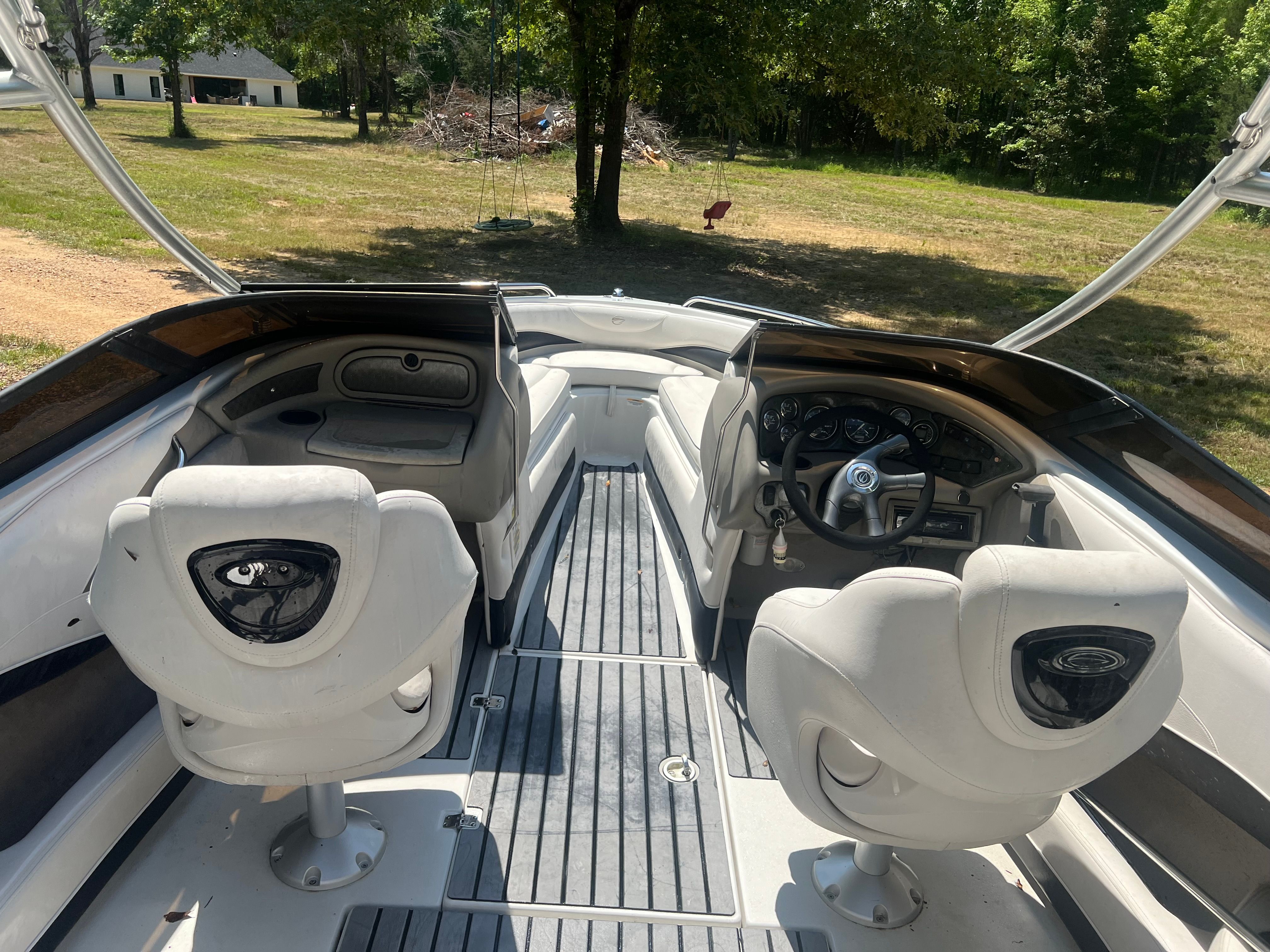 Interior of a 2001 Crownline 202 BR boat with white seats.