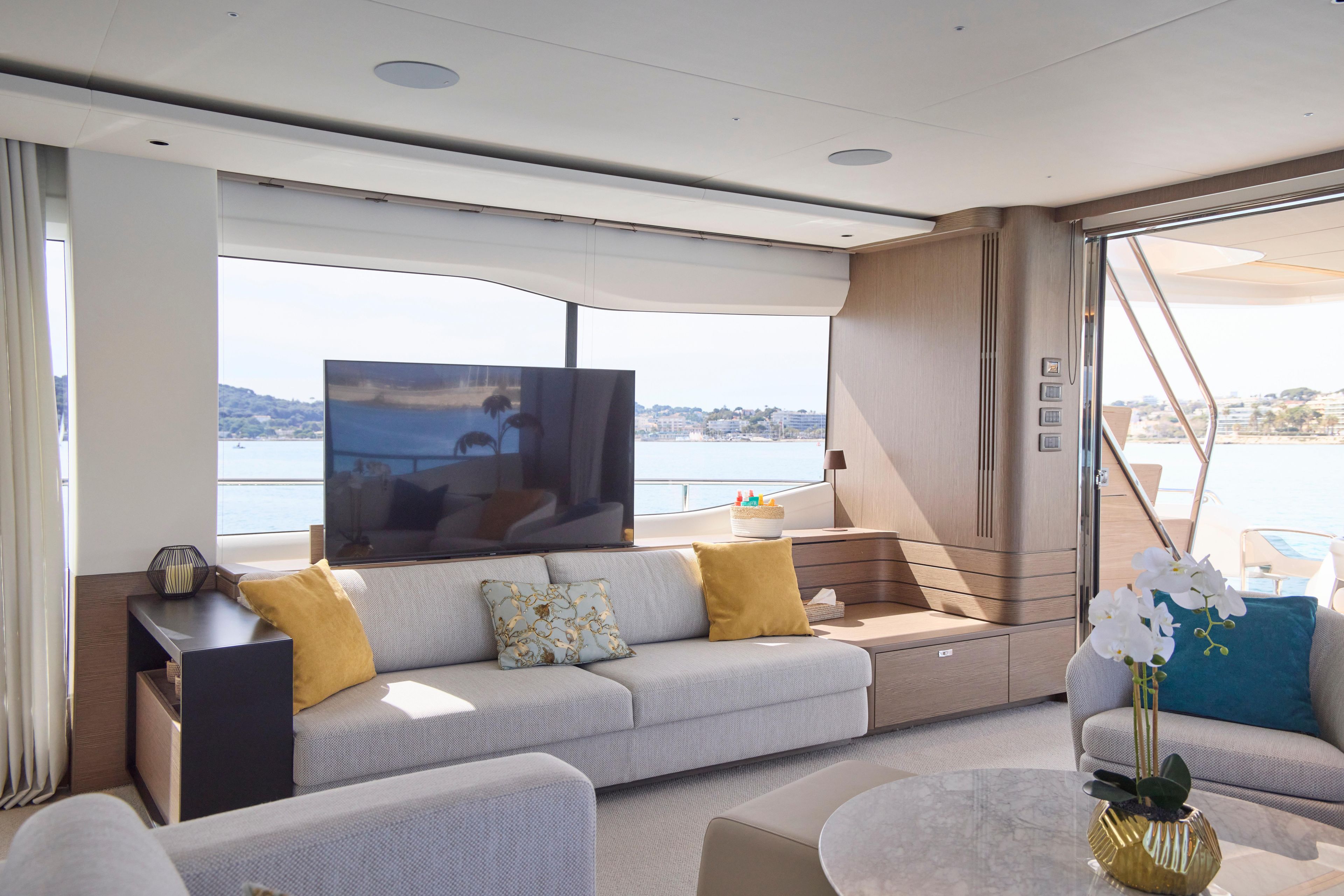 Luxurious interior of 2024 Princess Y85 yacht with modern decor and scenic ocean view.