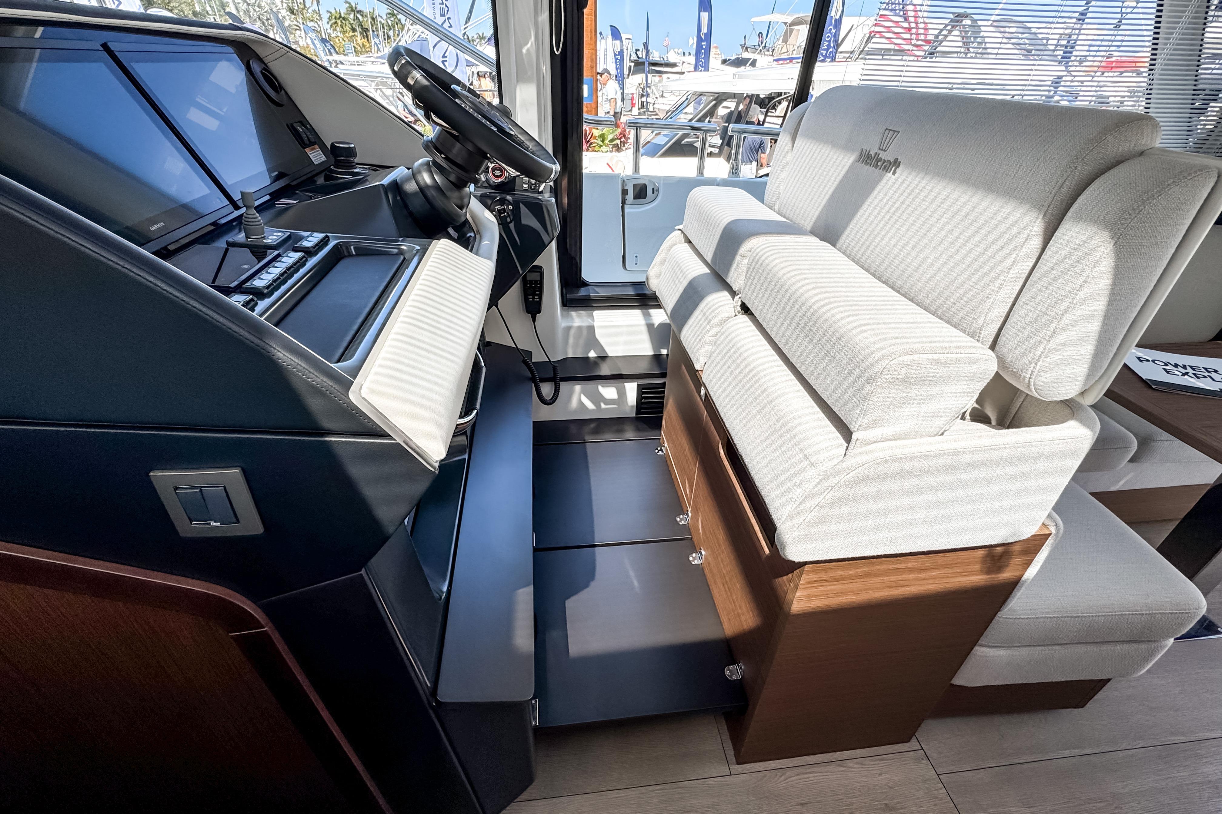 Interior of 2026 Wellcraft 44 Explorer with helm and seating area.