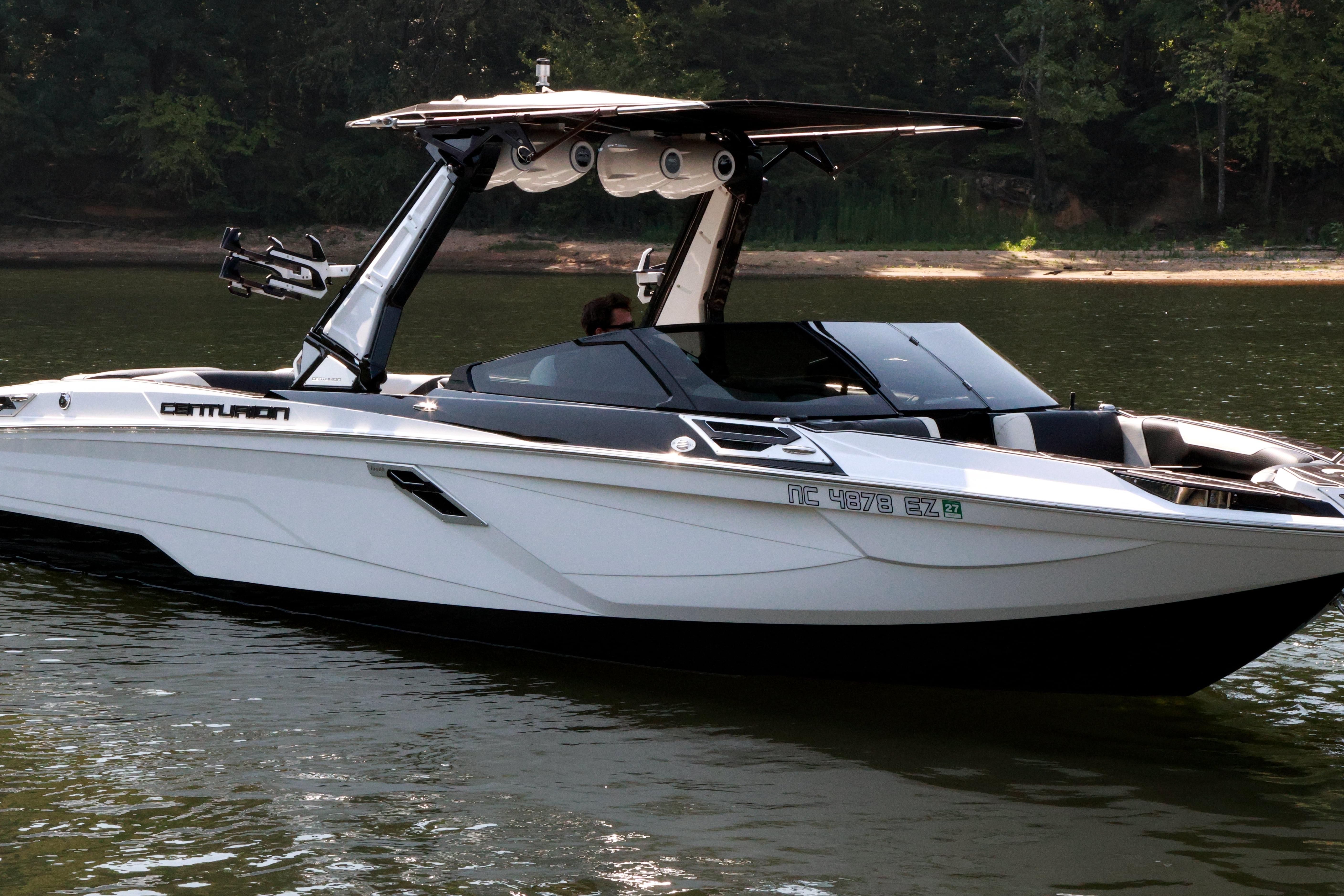 2022 Centurion Ri265 boat on calm water, featuring sleek design and modern amenities.