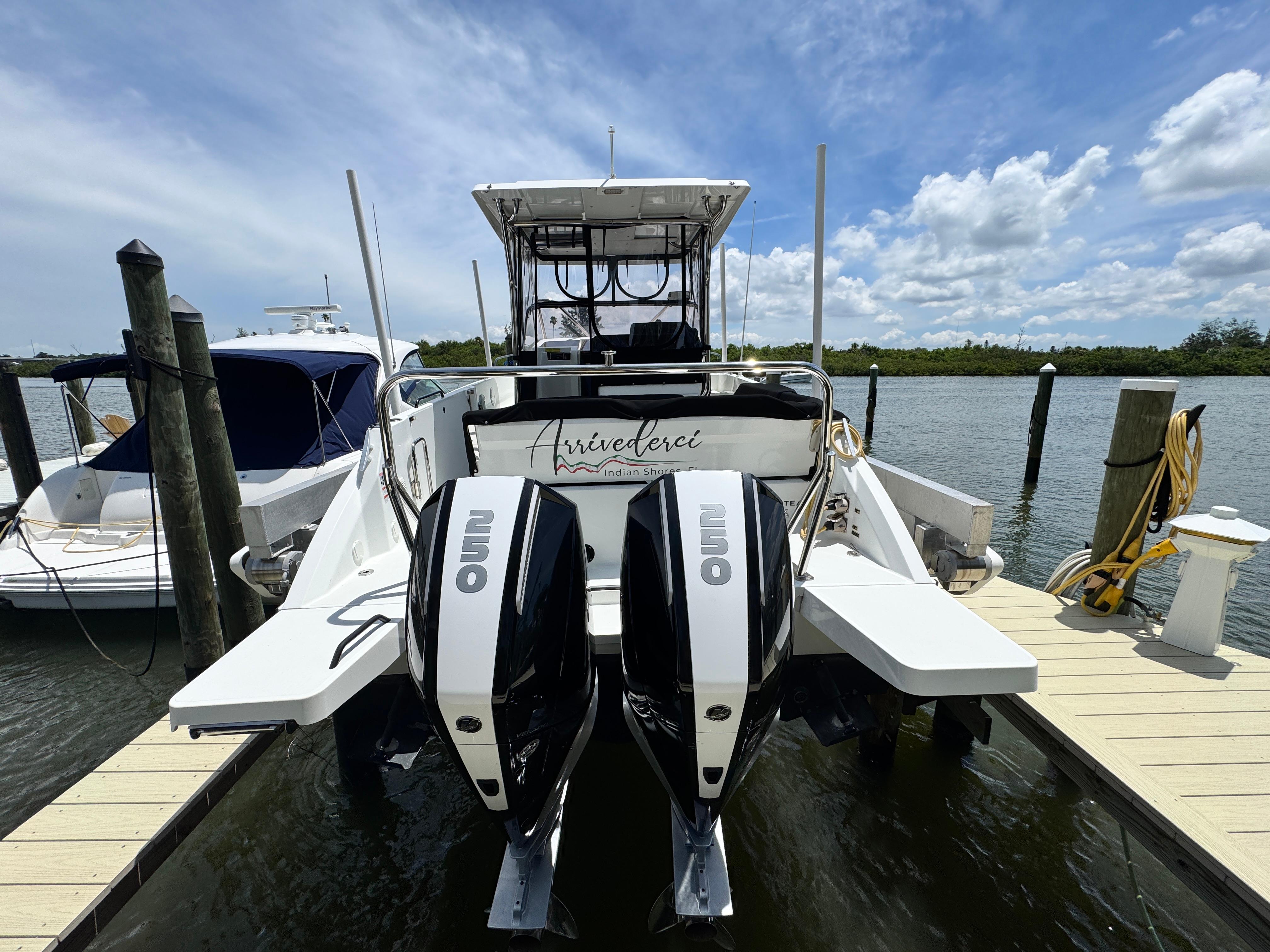 2022 Beneteau Flyer 9 SUNdeck docked with dual outboard engines under a clear sky.