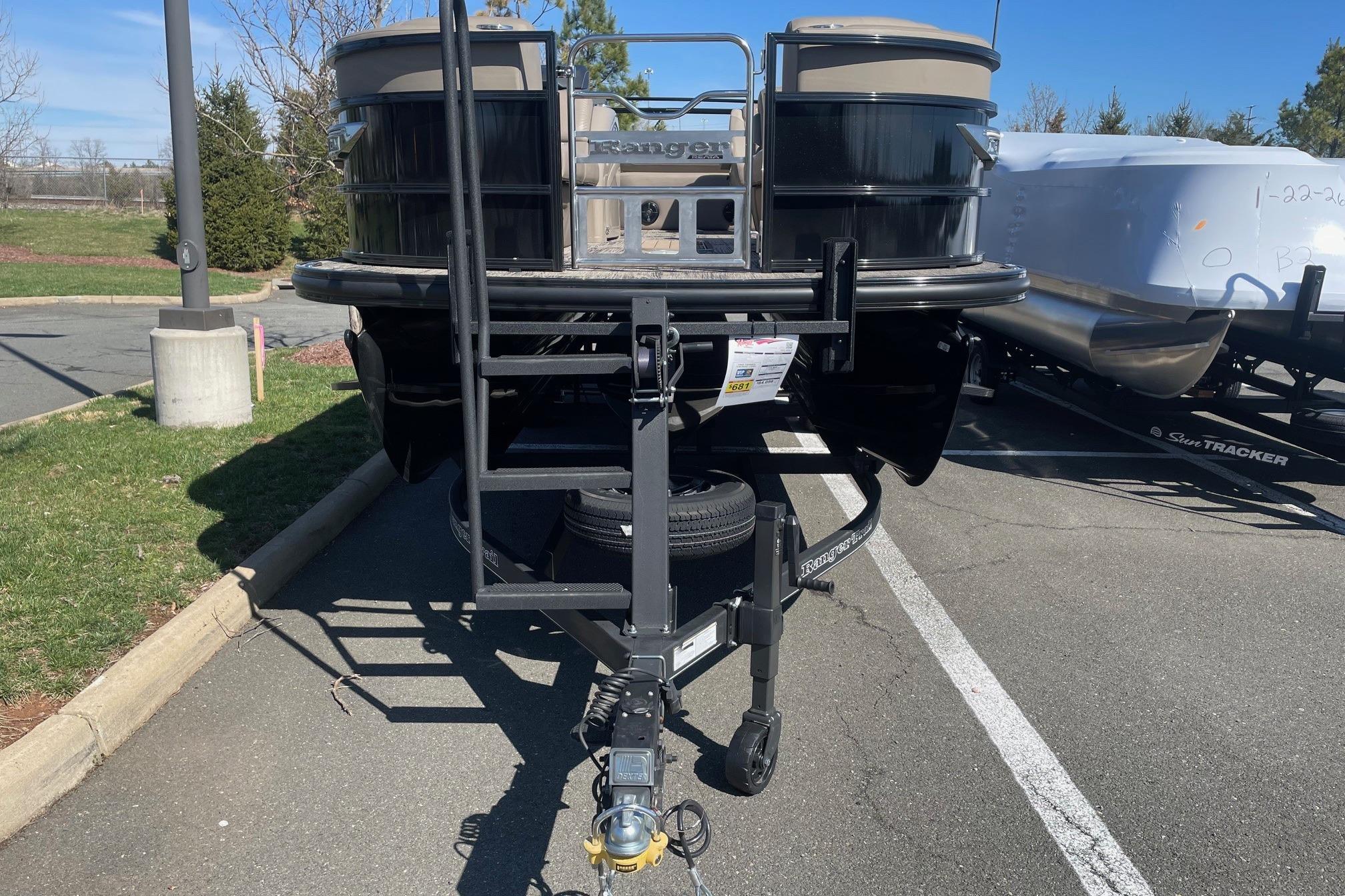 2024 Ranger 2500LS pontoon boat on trailer in parking lot.