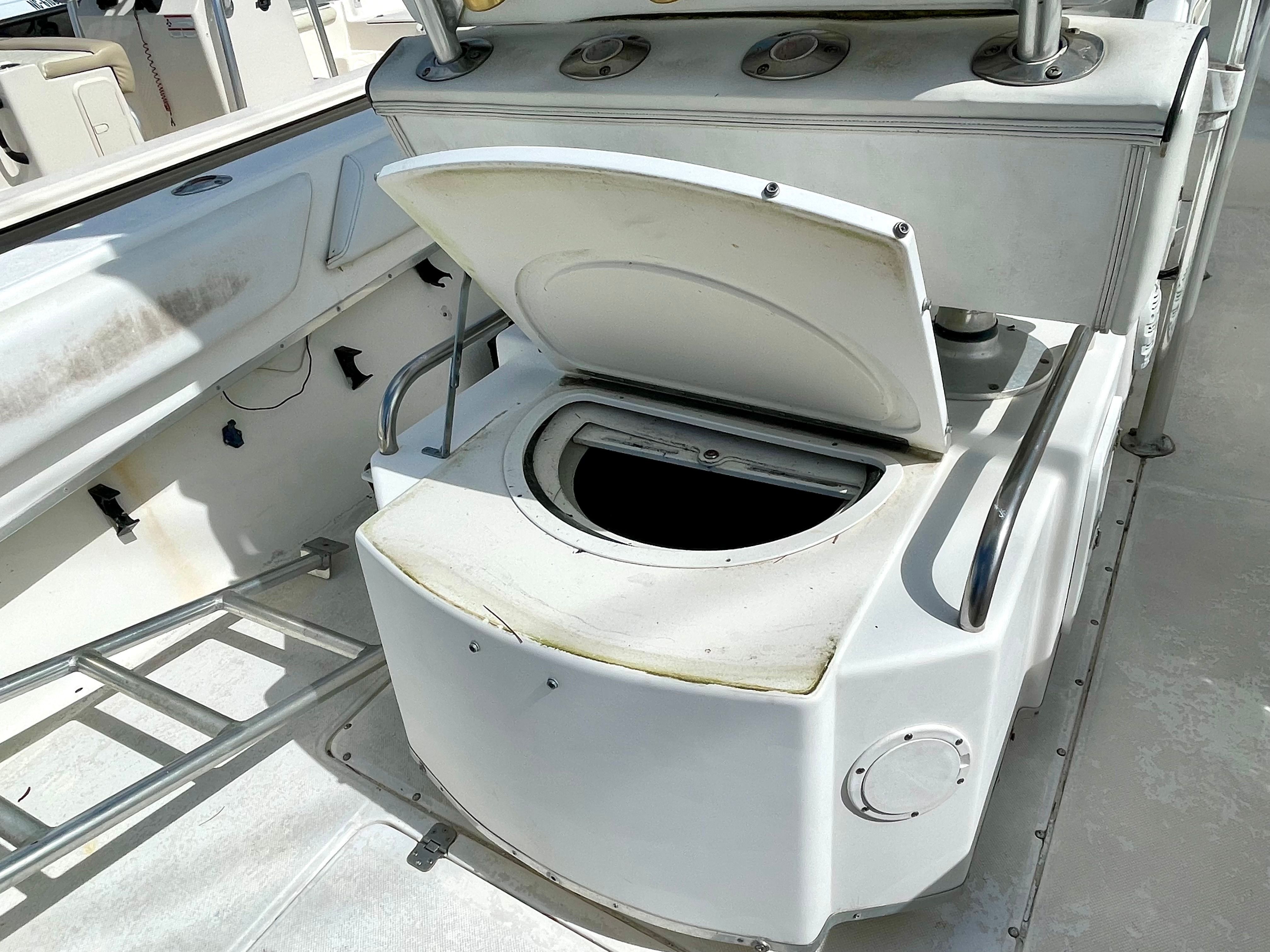 Open storage compartment on a 2000 Fountain 25 Sport Fish boat.