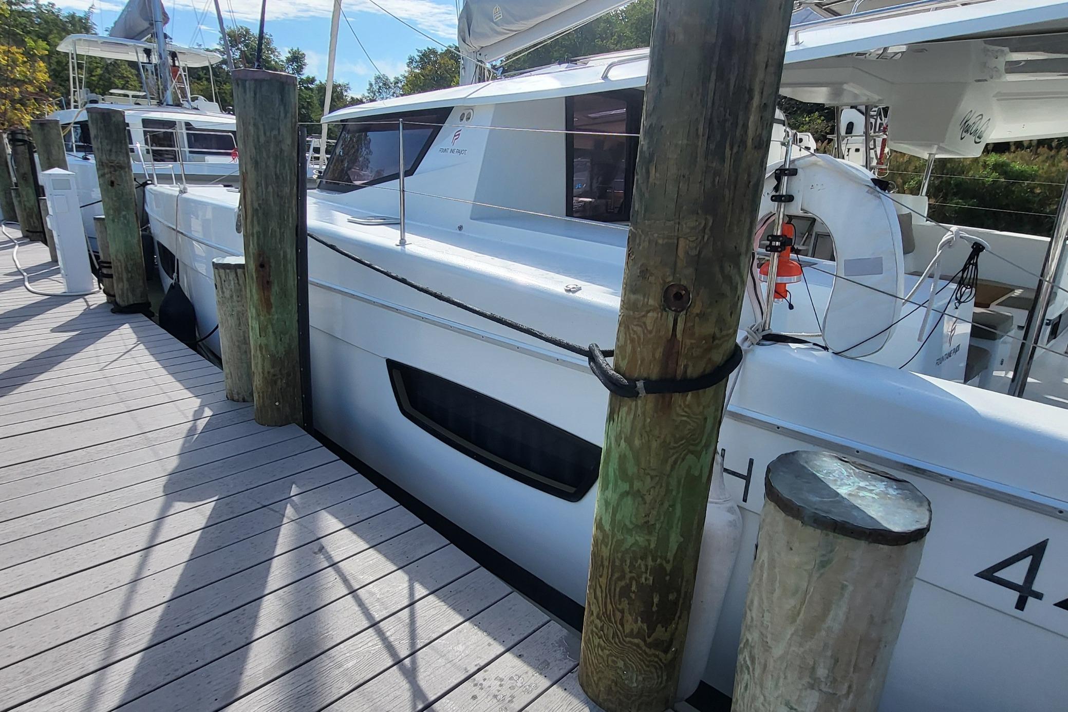 2018 Fountaine Pajot Helia 44 catamaran docked at a marina.