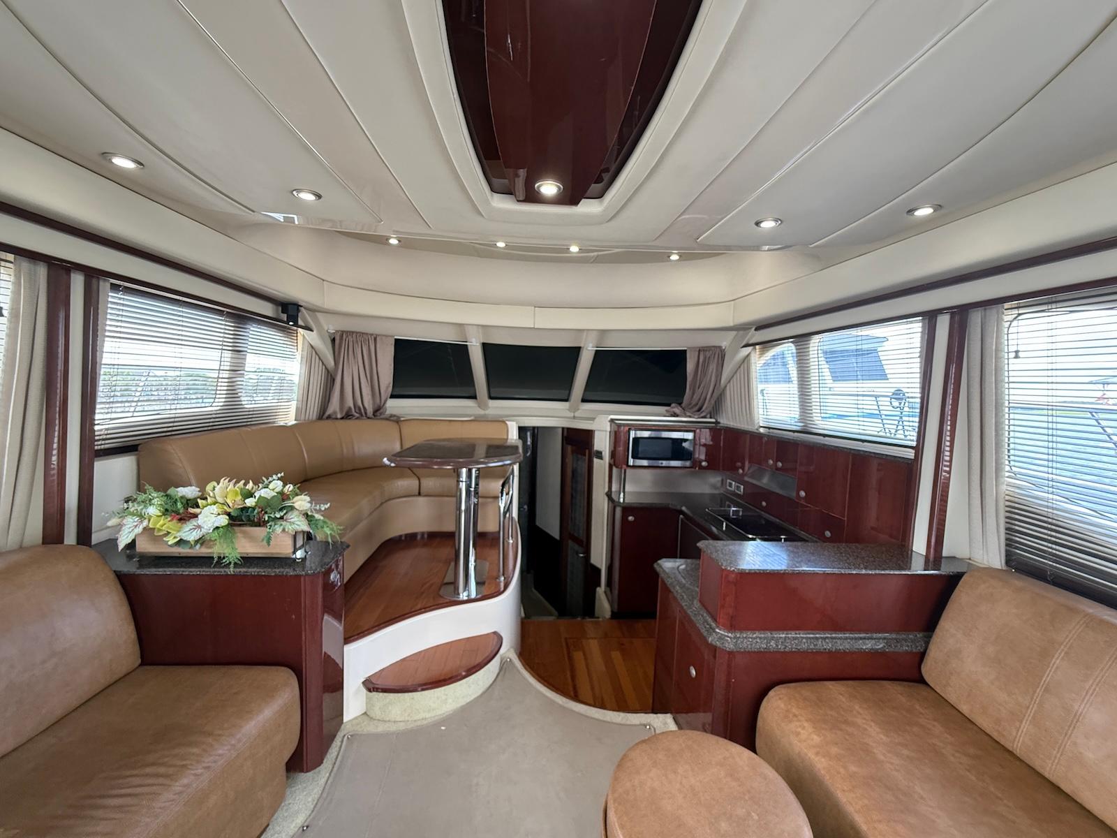 Luxurious interior of 2007 Sea Ray 52 Sedan Bridge yacht with elegant seating and modern amenities.