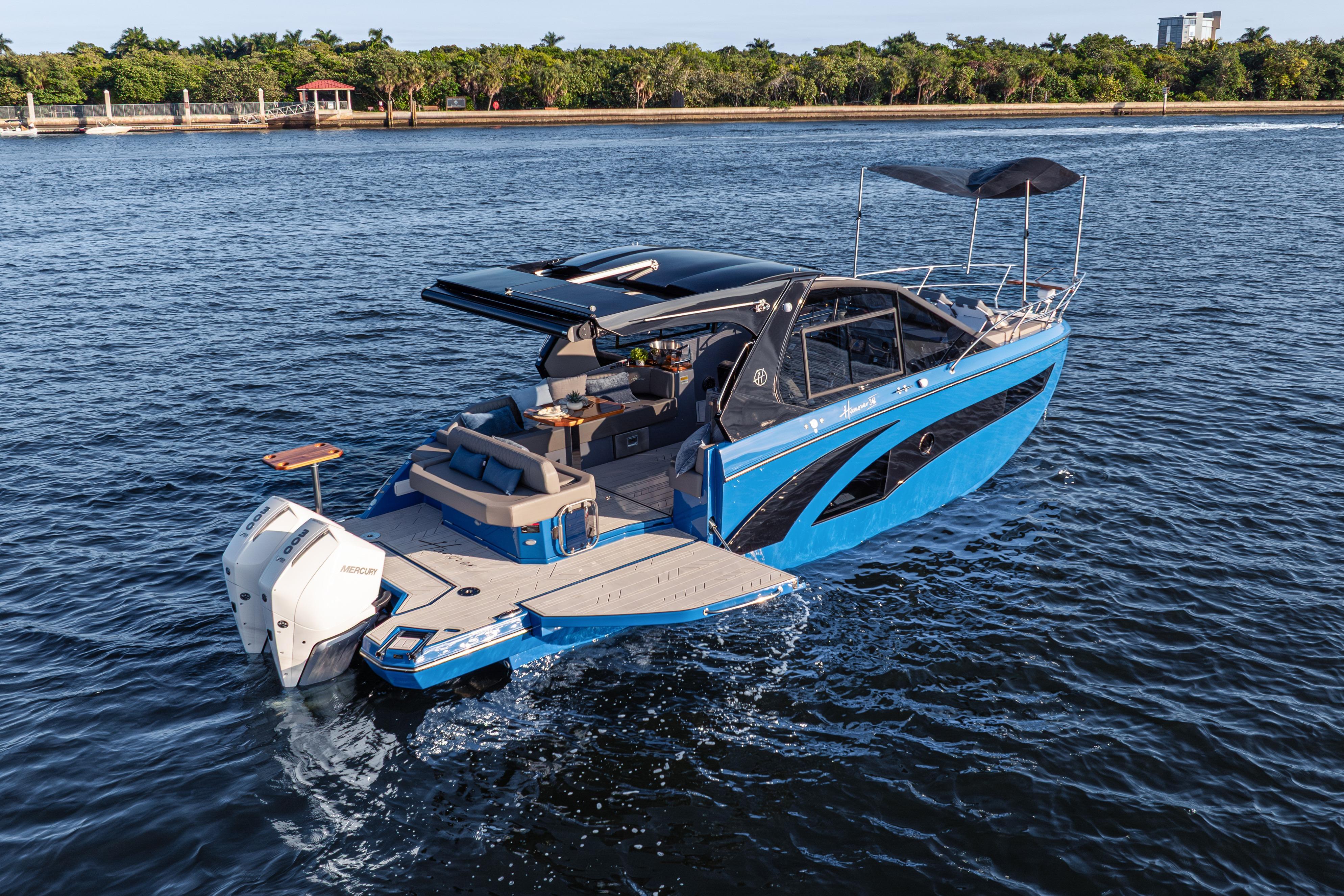 2026 Hanover 347 boat cruising on a serene waterway, featuring sleek design and modern amenities.