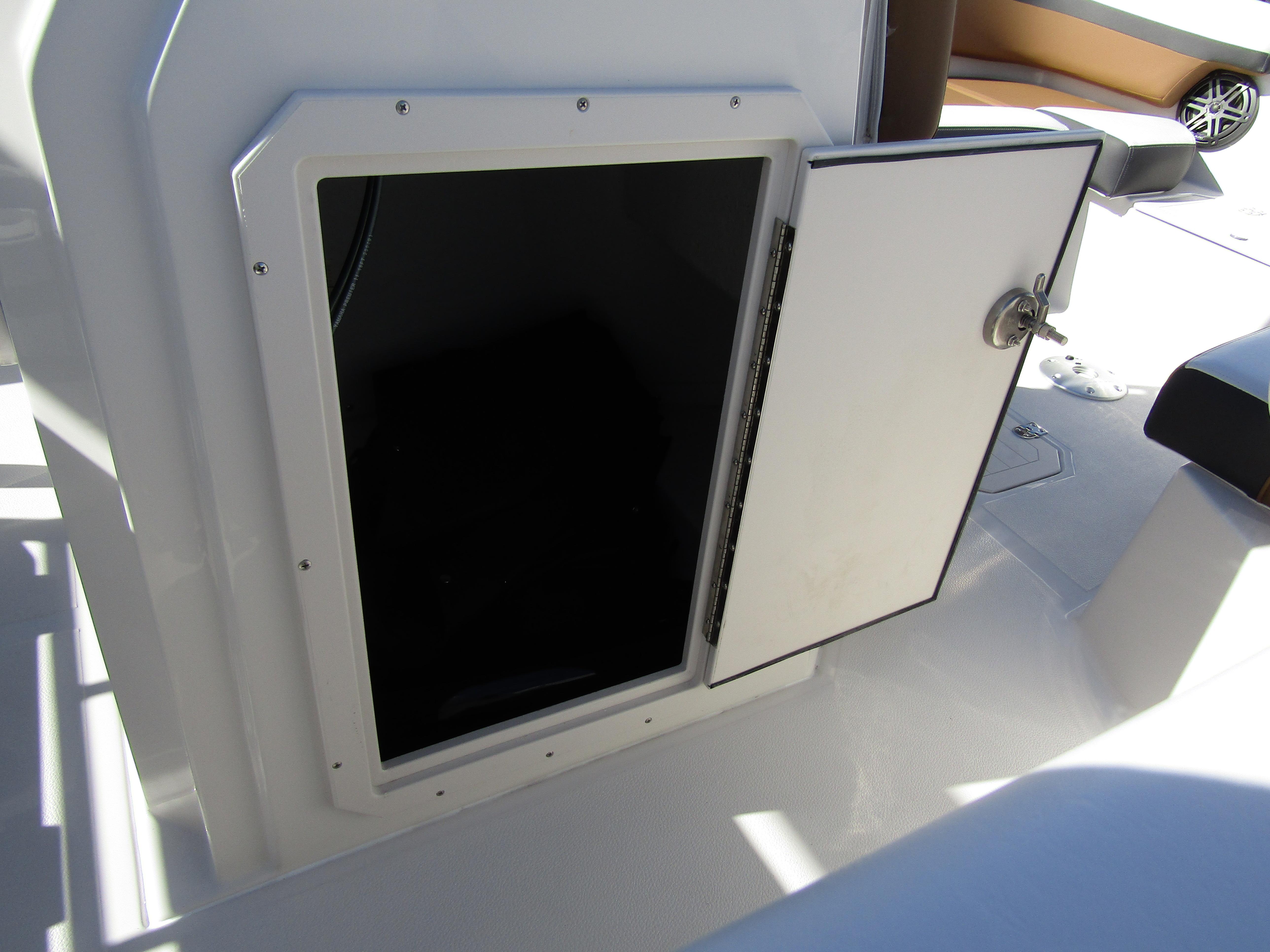 Open storage compartment on a 2024 Starcraft SVX 191 OB CC boat.