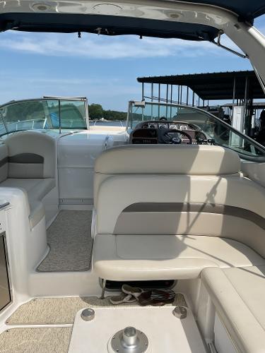 Interior of a 2008 Chaparral Signature 310 boat with beige seating.