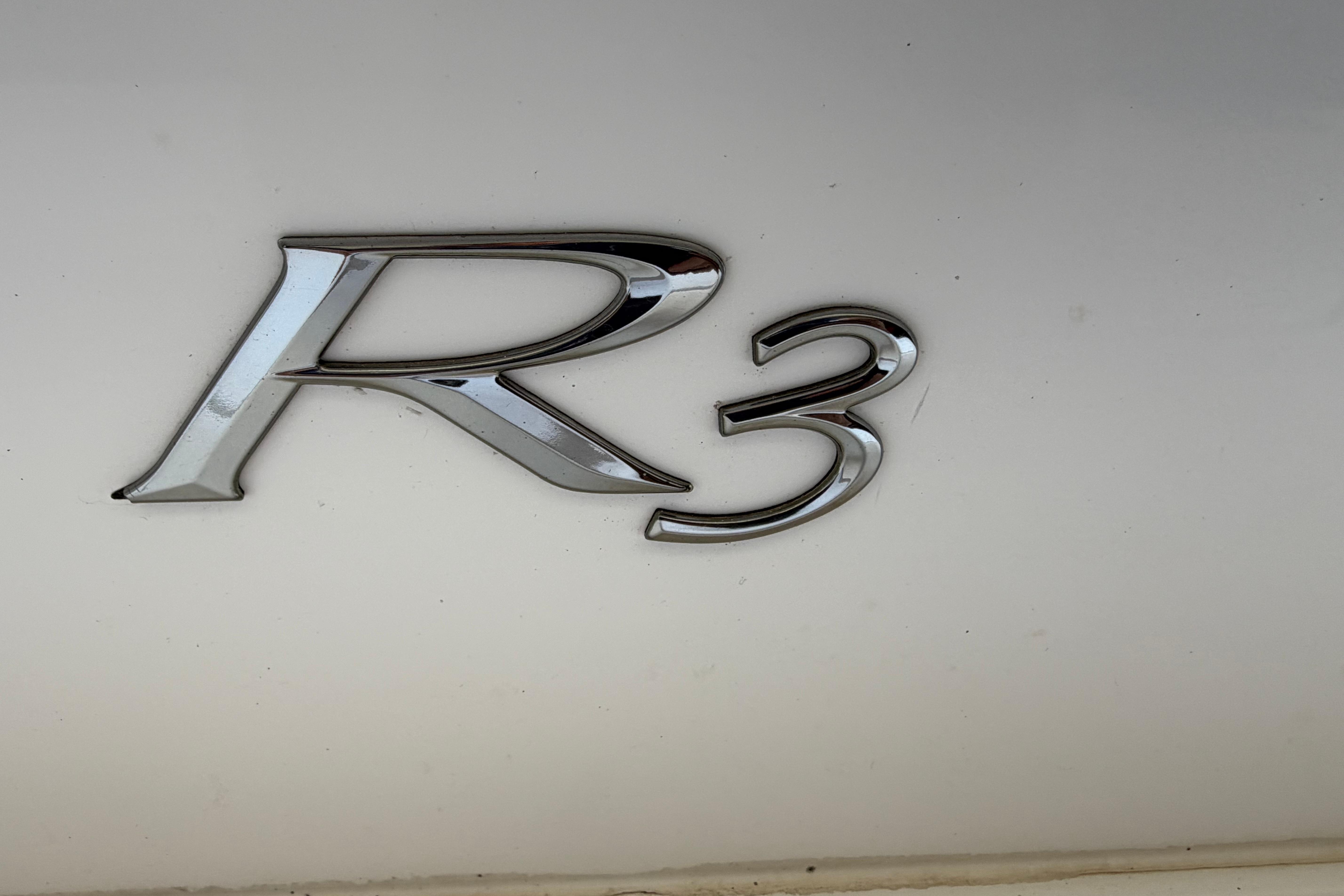 Chrome "R3" emblem on a 2017 Cobalt model vehicle.
