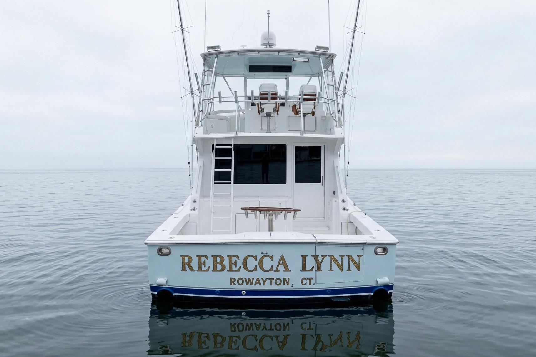 Viking 50' Convertible 2000 boat "Rebecca Lynn" on calm water, rear view.