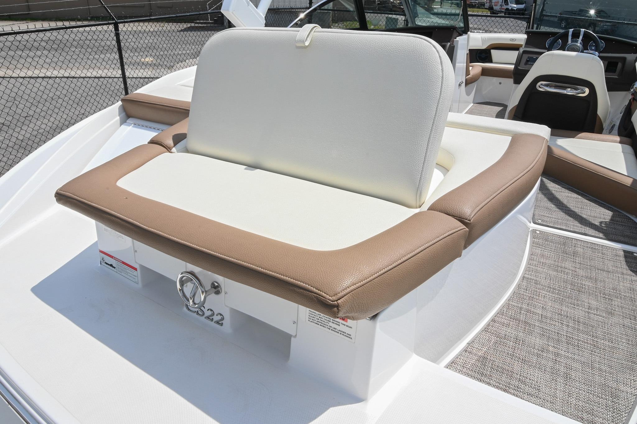 2022 Cobalt CS22 boat interior with beige and white seating, showcasing luxury design.